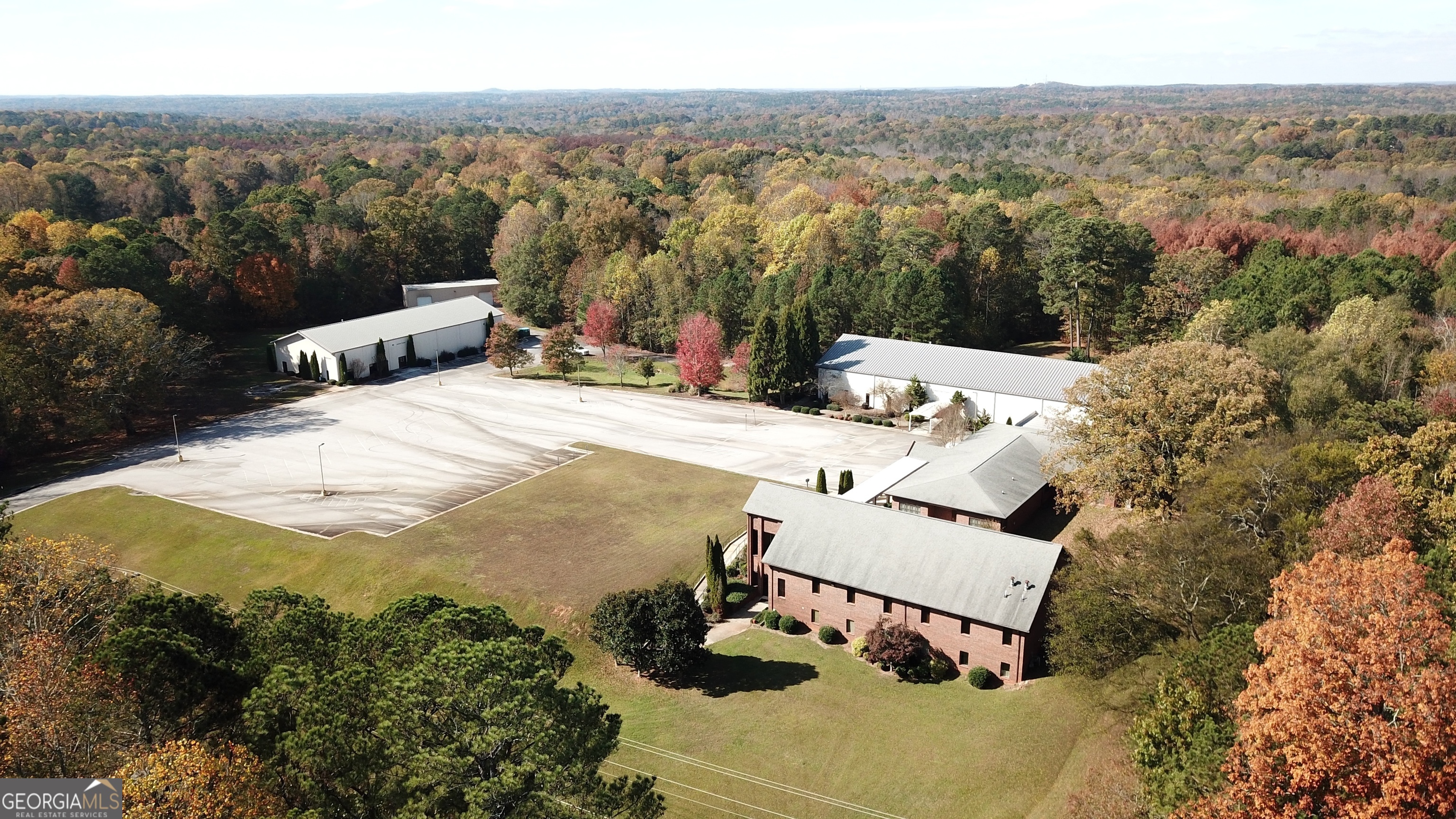 Exceptional Church Property on over 11 Acres, ideal for worship, education, and/or community engagement. Discover this rare opportunity to own a versatile and expansive church campus. With five distinct buildings, and over 175 parking space, this property offers endless possibilities. The main church building is welcoming space for worship and special events. It contains a 3,300 sq. ft. sanctuary that seats approximately 250 people, with a lower level having 7 classrooms and 2 restrooms -- perfect for Sunday school or community programs. Next to that building is the church office. It contains a dining hall of over 2,000 sq. ft. with a fully equipped commercial kitchen and pantry. There are also 5 private offices and 2 restrooms, ideal for administrative use. Connected to that building is the "family life center". It contains 10 classrooms, including 4 interconnected rooms for children's activities, 2 large bathrooms and a small child's bathroom for added convenience. There is also a contemporary worship space of over 4,600 sq. ft., featuring a full-size stage and backstage dressing room with an attached full bathroom. Across the large parking lot from those three buildings is the "activity center". It contains a full-size gymnasium (5,600+ sq. ft.) for sports, recreation, or large gatherings. 2 bathrooms with showers, 2 classrooms, and a fellowship hall/cafe lounge room for casual meetings or events. Finally, there is a 2,250 sq. ft. storage building with a built-in loft and additional storage lockers, offering ample space for equipment, supplies, and more. Across the property, you will find beautifully maintained grounds with plenty of room for outdoor activities or future expansion. This property is perfectly designed to meet the needs of a growing congregation, community organization, or educational institution. Whether you're hosting worship services, educational programs, or large-scale events, this campus provides the flexibility and functionality you need. Schedule your private tour today and envision the possibilities this incredible property has to offer!