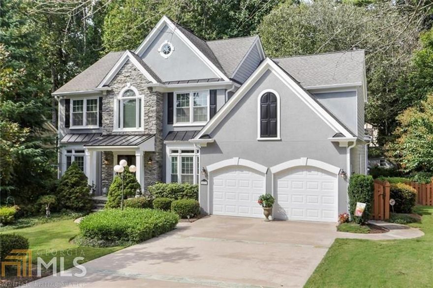 Inviting executive home in the very sought-out Pope High School district. Owners have lovingly maintained this beauty and particularly enjoy sitting on their beautiful screened porch or playing pool and watching movies in their daylight terrace level. The master bath has a frameless shower door and updated features. The kitchen has a full view of the spacious family room where entertaining is easy. The backyard has a level play area and wooded section for privacy. There is extra storage in the basement or the space could be converted into a bedroom. Homes like this don't stay on the market long. This beautiful community has great amenities too!