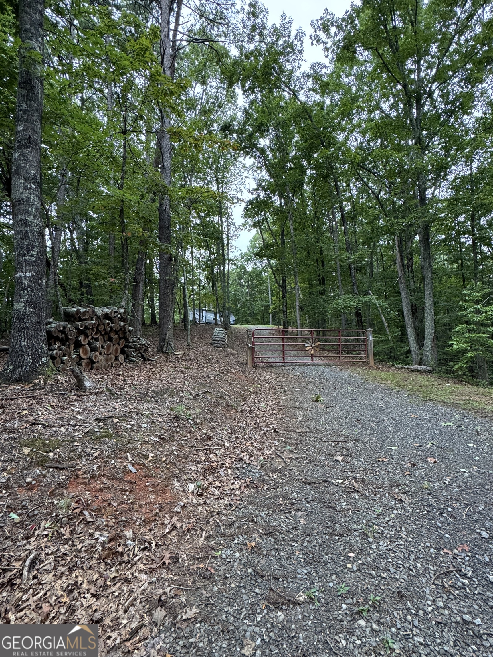 Tucked away in the beauty of the North Georgia mountains, this exceptional property offers multiple homesites, access from two county roads, privacy and natural beauty. Whether you're envisioning your dream home or a peaceful mountain cabin retreat, this property offers the ideal setting to bring your vision to life. A well and septic system are already installed, saving you time and money. The property features gently rolling topography with mature hardwood and pine timber. With county road frontage and electricity already on site, the property is ready for development. Don't miss your opportunity to own this rare North Georgia mountain property. Call Land Specialist Matthew Sheffield today to schedule your private tour and experience the possibilities firsthand.