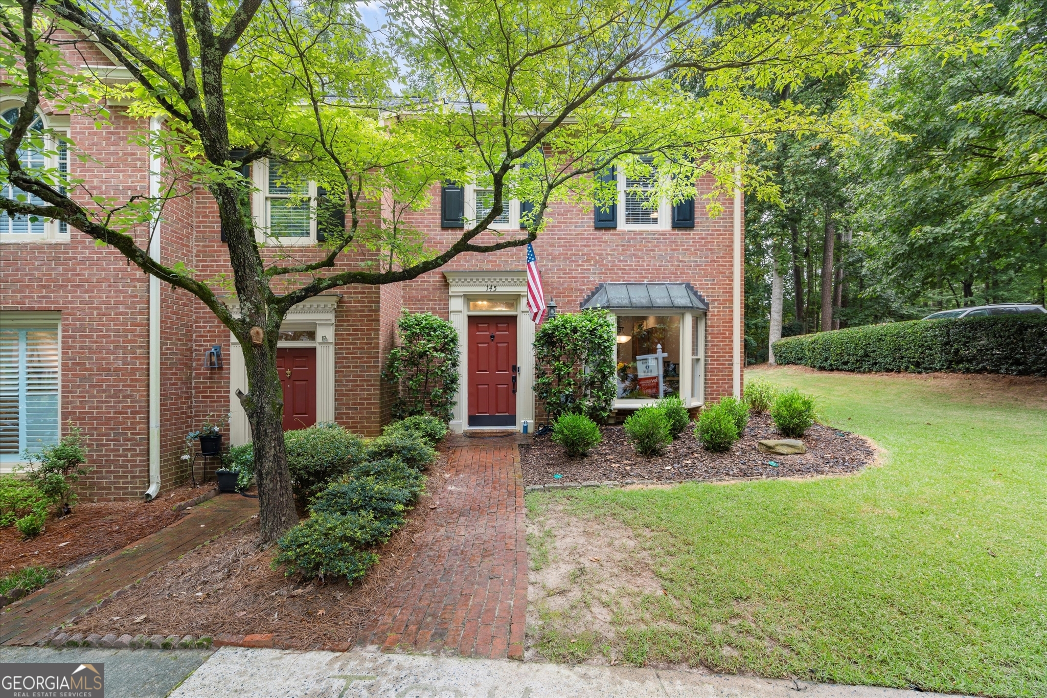 Don't miss the chance to call this amazing end-unit townhome with low HOA dues in an amazing Roswell location HOME! This home is tucked back in a quiet and peaceful community just a mile from GA-400, steps from Big Creek Park and the Greenway, and super close to shopping & restaurants. Enter in and be greeted with tall ceilings and a great-flowing floorplan, with kitchen that includes new stainless steel appliances and large eat-in dining space (even with a window seat!) that flows into spacious living room, centered by fireplace and easy access to spacious, fenced and private backyard with views of trees and not 1 but 2 patios as well as 2 storage spaces (storage shed found beyond fence). Speaking of storage, sellers have made use of every inch building in 2 closets with custom storage racks on the main floor and also a beautifully renovated powder room. Upstairs, find 2 generously sized bedrooms, primary suite offers extra nook perfect for work from home space, workout equipment, or vanity area. Primary bathroom offers both soaking tub and shower, and a great-sized closet. Secondary bedroom is also spacious with an en-suite bathroom with updated vanity, mirror, and light, and a custom closet system. Laundry is conveniently located on same floor as bedrooms. This home is truly a gem and pride of ownership shows--water heater replaced this year and both AC and roof are 7 years old!