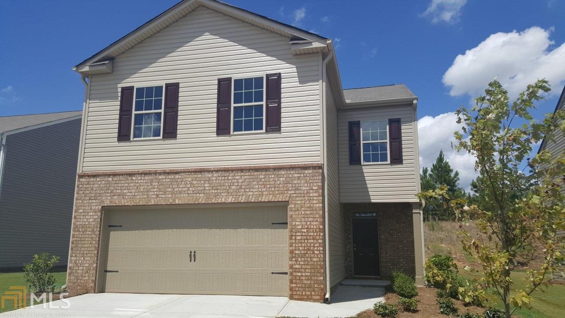 Quality & Affordability in Fairburn close to Duncan Park, Atlanta Metro Studios & Atlanta's Hartsfield Jackson International Airport. This open concept Aisle plan has 4 Bedrooms, 2.5 Baths, 2 Car Garage & Combination Dining/Living rm. Designer Kitchen has espresso 36" cabinets, granite countertops, tile backsplash & SS appliances. Great room has black slate hearth fireplace. LVP wood looking flooring throughout 1st floor. Owners Suite w/WIC, separate shower/tub & dual vanities. Convenient upstairs laundry. One 2ndary bdrm w/WIC. Screens. PestBan. 1-2-10 Warranty.