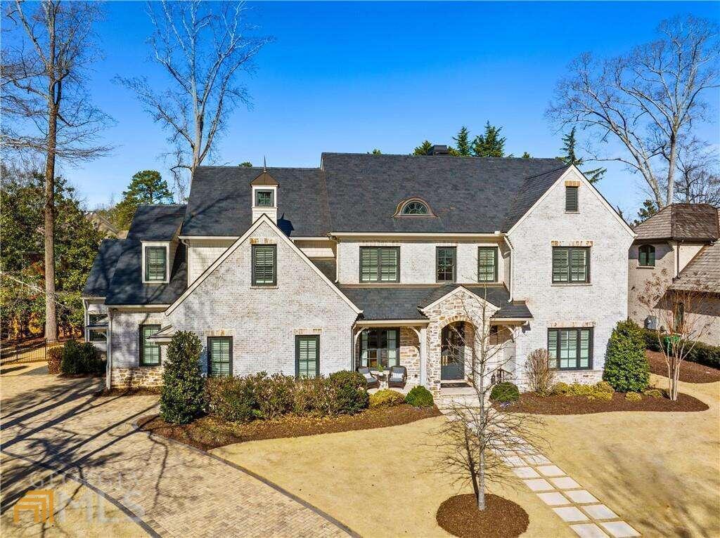 New in Historic Brookhaven, an exceptional opportunity to own a beautiful like-new construction home on a charming enclave of only 8 homes. Impeccably designed by Classic Concepts of Atlanta and built by Deane Johnson Homes, this home is a masterpiece of luxury and craftsmanship. The upgraded natural slate roof and beautiful copper natural gas lantern, as well as professional landscaping, exude curb appeal. The main level has 11CO and 14CO ceilings, stained 8C white oak hardwood floors, 8CO 6-panel hardwood doors, Emtek Rectangular Bronze, and Hampton Crystal Knobs. 3-story elevator ready. The chefCOs dream kitchen is elegantly appointed with a 10-foot Island and backsplash made of polished porcelain (Antolli Tech (Italy) Calcutta Lincoln porcelain) with surrounding quartz countertops. Top-of-the-line appliances included a Wolf 30C professional M series double oven, Wolf 48C pro range top with four gas burners and double griddle, Subzero 48C refrigerator/freezer with interior filtered water and ice dispenser, Bosch dishwasher, Scotsman icemaker, Kohler 35C stainless steel under-mount sink, Brizo faucet, Everpure under sink water purifier filtration system. The attached butlerCOs pantry includes an Electrolux 32C refrigerator, a built-in Frigidaire 27C microwave, and a huge walk-in pantry with custom-designed shelving by Creative Closets. The wet bar includes a hammered nickel bar sink, a Brizo faucet, a wine refrigerator, and a beverage center. Open to the great room (14CO ceilings), enjoy grey wash pine beams, Francois & Co. custom mantle 80C by 60C of French stone grey finish, natural gas fireplace, and Custom designed cabinets flanking the fireplace. The enormous screened porch is a true extension of the living area and can be used all year. You will love the vaulted ceiling and stone fireplace (wood burning) with reclaimed wood mantle. Exit to the ultimate entertainerCOs backyard, with a covered porch and a Lynx Sedona 36C grill. The oasis continues to the large Neptune designed saltwater pool, heated hot tub, three sheer descents and lighting, Aqualink iPhone app and remote, and self-cleaning system. The oversized primary retreat includes a 14CO trey ceiling with white washed shiplap and a large walk-in closet with a custom cabinet system by Creative Closets. The spa-like bath welcomes you to relax with counter to ceiling mirrors, Rohl faucets and shower system, large soaking tub, and pristine marble countertops and flooring. Finishing off the main level is an executive study with built-in bookcases, two half baths (one with in and out access to the pool), and a gorgeous laundry room with a dog spa and shower. The second floor (10CO ceilings) consists of 4 spacious en-suite bedrooms, custom vanities by CDK cabinets with quartz countertops, Delta fixtures, and large walk in closets. Also find a laundry room option finished storage space. The terrace level has 10CO ceilings, engineered hardwood floors, an exercise room, full kitchen with Granite kitchen island, Blanco under-mount sink, Samsung refrigerator/freezer (25 cubic ft), and full-size Whirlpool dishwasher. Additional Exceptional features not to miss include: Smart Home Harmonic Homes System (Speakers inside and out) with a remote control app, Ring doorbell, two security cameras, Smart home lighting: Insteon one-touch lighting zones, and three motion detection security lights.