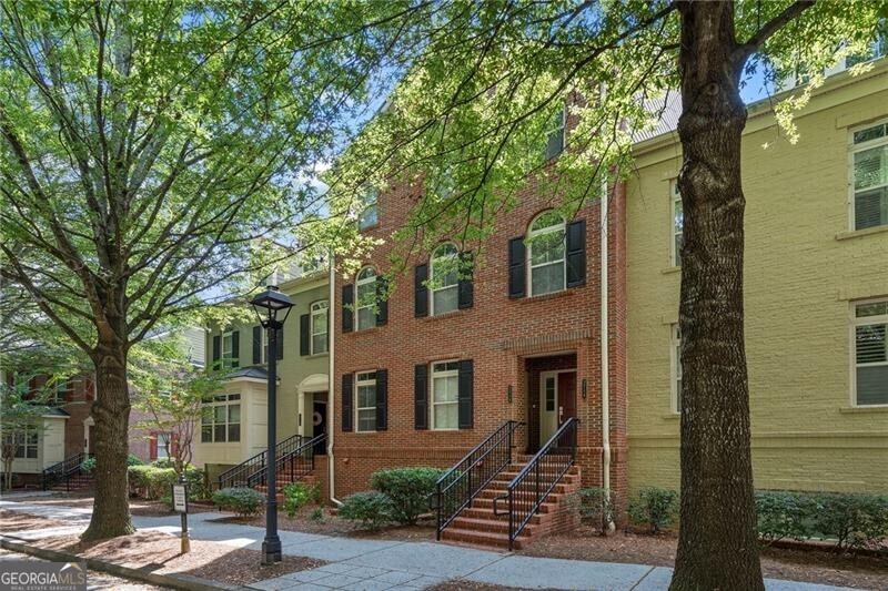 Introducing the best kept secret in Alpharetta! Luxurious townhome in Enclave at Milton Park - tucked away on a tranquil, tree-lined street with walking access to the Greenway and minutes to Avalon, Downtown Alpharetta, GA 400, and all that Awesome Alpharetta has to offer! Stroll just outside your front door to the quaint Tuscany Cafe and several other wonderful restaurants and shops. We believe you will find this renovated townhome is the best value in the area for the lifestyle it provides. Lovingly maintained and beautiful renovations including kitchen and primary bath. Freshly painted throughout. New carpet. Highly sought after floor plan with two separate iiving areas including fireside family room that opens to the covered balcony and a separate living room that can also serve as a home office or media room. Wet bar perfect for entertaining. Upstairs you'll find a spacious primary suite and stunning renovated primary bath. Two additional bedrooms and full bath as well as the laundry room complete the upper level. On the lower level is the one car garage with lots of extra storage space. Additional driveway parking. Enjoy low maintenance living and a lifestyle like none other. Don't miss out...this is a gem!