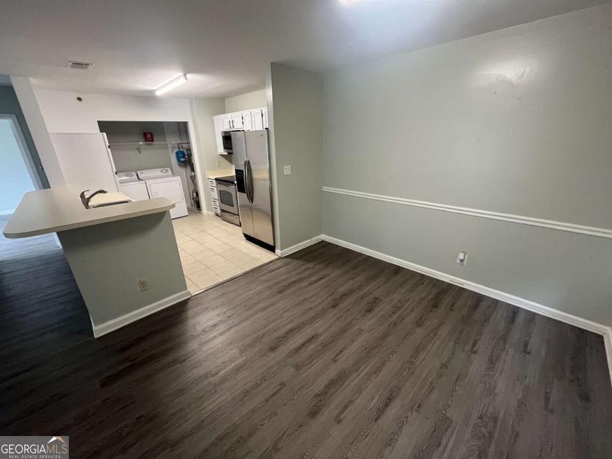 Awesome condo in Smyrna's Mill Pond. Light-filled living/dining on durable laminate; tile in kitchen. Stainless-steel appliances and good prep/storage space. Split-bedroom layout: spacious primary suite with full tub/shower bath; second bedroom + full hall bath for guests/office. In-unit laundry. Tranquil setting with scenic views of trees/pond/greenspace and easy access to schools, parks, shopping, dining, and public transit. HOA $384/mo. Move-in ready in a well-kept community-schedule your showing.