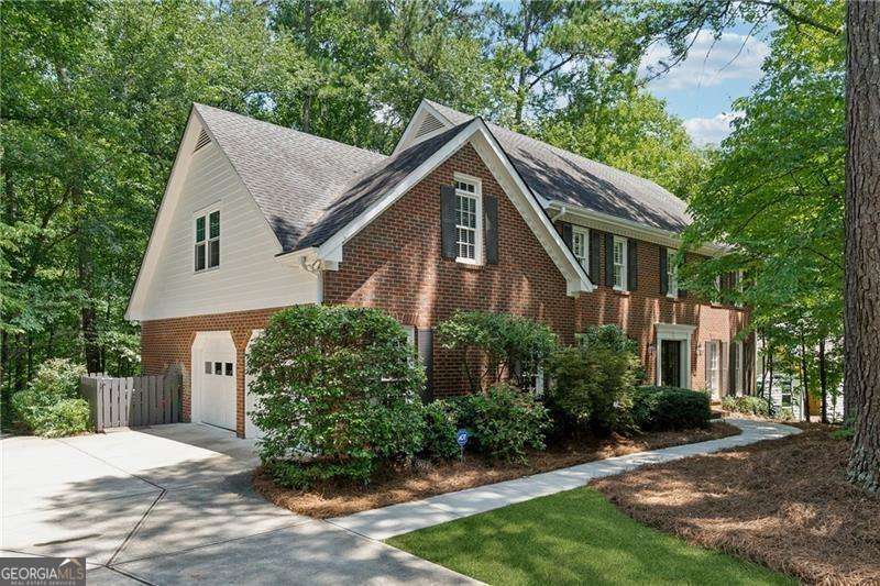 Welcome to 904 Willeo Place, a rare opportunity in River Forest! This well-maintained one-owner home is tucked away on a quiet cul-de-sac in East Cobb's highly sought-after Timber Ridge Elementary, Dickerson Middle and Walton High School district. Enjoy the peace and privacy of a wooded backyard that backs to a creek, creating your own natural oasis right in the heart of Marietta. Gorgeous double front doors lead into a foyer flanked by formal living and dining rooms. A fireside family room is spacious yet cozy, and hardwood floors are throughout the main floor. The kitchen is perfect for gathering, cooking, and entertaining, featuring an island, breakfast bar, wall oven and microwave, electric cooktop, built-ins, pantry and breakfast room. You'll love the vaulted screen porch and deck for sipping your coffee and listening to the sounds of nature. Upstairs is the primary suite with walk-in closet, dual vanities, soaking tub and tiled shower. Three bedrooms share a hall bath. A second master suite was created from the bonus room and includes a TV/sitting room and a full bath. The finished basement offers flexible living space for a media/rec room or gym, plus a dedicated workshop and extra storage for all your projects and hobbies. Located in the welcoming River Forest swim/tennis community, this home is just minutes from Canton Street in Roswell, the Avenues of East Cobb, and all the top-rated schools and amenities East Cobb has to offer. Don't miss it!