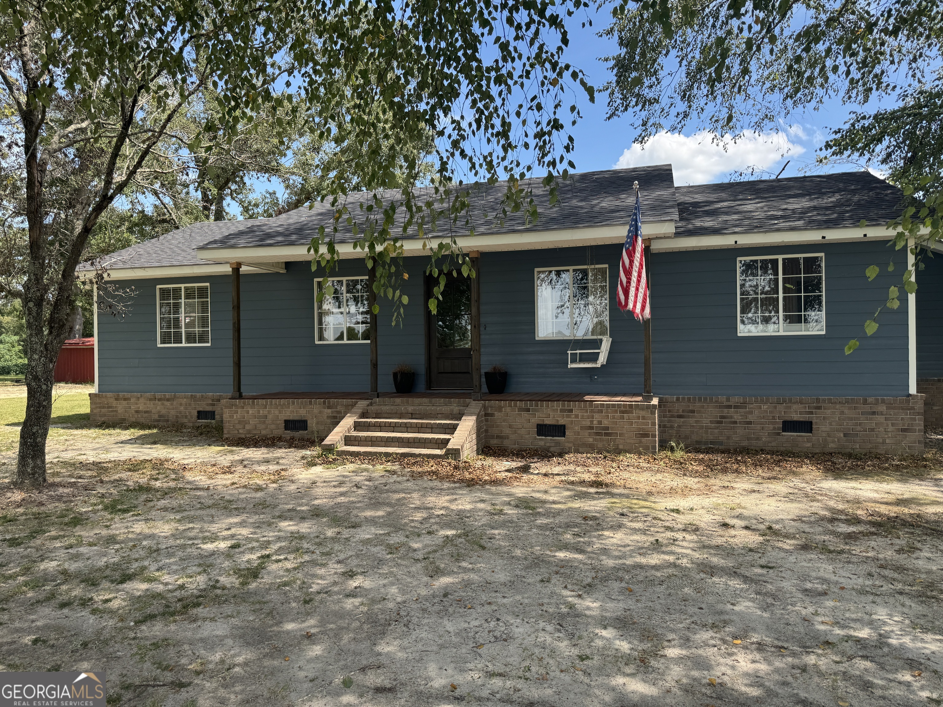 This 4-bedroom, 3-bath home at 6424 Collins Road in Cobbtown, GA sits on a full acre and offers 2,166 square feet of living space. With a remodeled kitchen, spacious primary suite, covered parking shed, deep well system, and modern finishes throughout, this property is move-in ready and designed for both comfort and practicality. As you step inside, you're greeted by an open living room featuring a modern fireplace accent wall and plenty of natural light. The layout carries seamlessly into the dining area, positioned near large windows that bring in backyard views, and then into the remodeled kitchen. The kitchen is designed for both function and style - with custom cabinetry, butcher-block island, farmhouse sink, and updated appliances. It opens to the dining space, making this a central gathering point of the home. Just off the kitchen is a spacious laundry and mudroom with built-in storage, perfect for handling daily routines. Moving through the home, the primary suite offers enough room for a full bedroom set plus a sitting area, with a walk-in closet and private bath. Three additional bedrooms provide flexibility for family, guests, or office space. The bathrooms include both updated finishes and a newly remodeled shower bath with patterned tile floors for a clean, modern touch. This home is built for efficiency as well - it features spray foam insulation, is 100% electric with two water heaters, and has a newly updated roof, making it extremely energy-efficient and worry-free for years to come. Outside, the property includes a carport for 2 vehicles, an outdoor concrete patio, and a deep well water system. The one-acre lot provides plenty of space for children, pets, or gardening, while still being manageable to maintain. Located minutes from Metter and Statesboro, this home combines a rural setting with easy access to schools, shopping, and I-16.