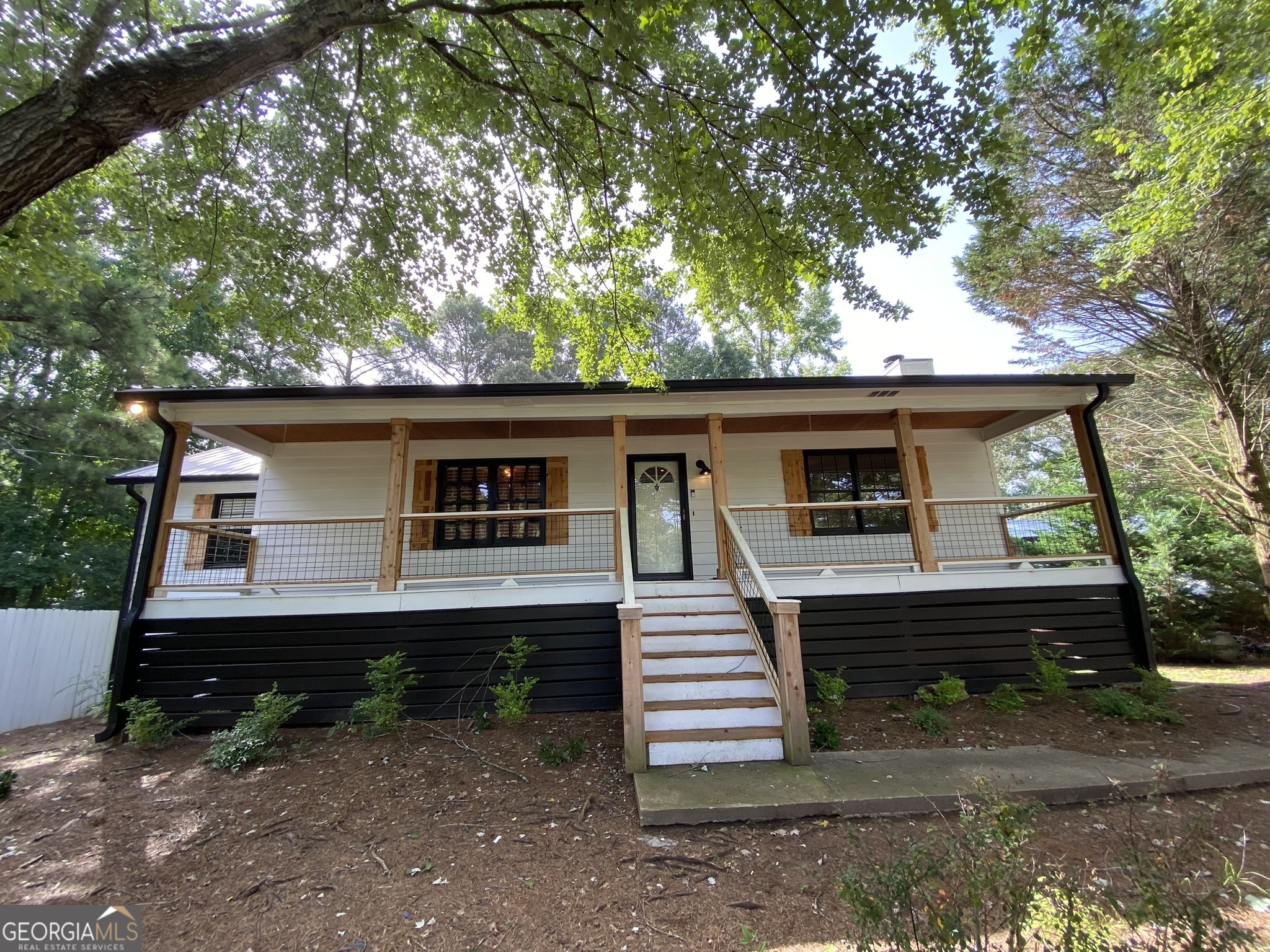 Discover your dream mini farm on 3.36+/- serene acres in South Douglas County, offering 3 bedrooms with a potential 4th, 3 full baths including an updated owner's suite, a recently updated kitchen, and a finished basement with a roughed-in second kitchen. The outdoor entertainment area features a screened porch, above-ground pool, tiki bar, grill area, firepit, and fenced backyard. Additional amenities include a 20x30 workshop with power and a 2650 sq. ft. barn with water and dedicated power. Conveniently located near I-20 and the Atlanta airport, this property provides the perfect blend of rural tranquility and urban accessibility. Contact Brett Ray to schedule a viewing or for more information. Don't miss this unique opportunity!