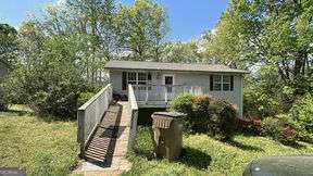 5 Minutes from Lake Lanier! Investor special or perfect for a handy homeowner! This spacious property offers ample area upstairs and downstairs with tons of upside potential. The lower level has been recently updated, and big-ticket items are already handled - HVAC replaced in 2024 and the roof is just 4 years old. The home needs some cosmetic TLC, but with solid bones and a great layout, it's a prime opportunity to add value. ***Seller needs occupancy through July while moving into their next home.***