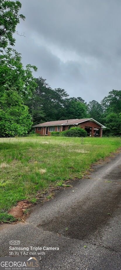 Photo of 374 LUTHER BAILEY Rd, SENOIA, GA 30276 (MLS # 10840596)