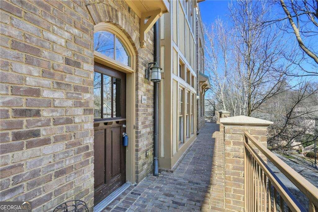 Lovely Community in Lake Claire. Sutherland Place features condos, townhomes, and single family homes within .8 miles from all the cozy shops and restaurants on McLendon.Open concept one level living offers up so much space and potential to put your stylish stamp on over 1000 square feet. Huge living and dining room combination with soaring ceiling featuring beam accents.Kitchen has honed/textured granite counter tops, and opens to the living room. Cabinets have glass fronts along with the wood making this a transitional space that could go traditional or modern.Guest powder room has a linen closet and separate laundry room/mechanical room tucked out of the way. Open concept with a privacy wall gives an airy feel to the generous bedroom and walk in closet.  Master bedroom has marble herringbone tile, shower/tub combo, and water closet nook. The unit comes with a storage closet conveniently located in the garage. 1 assigned parking space will also convey.