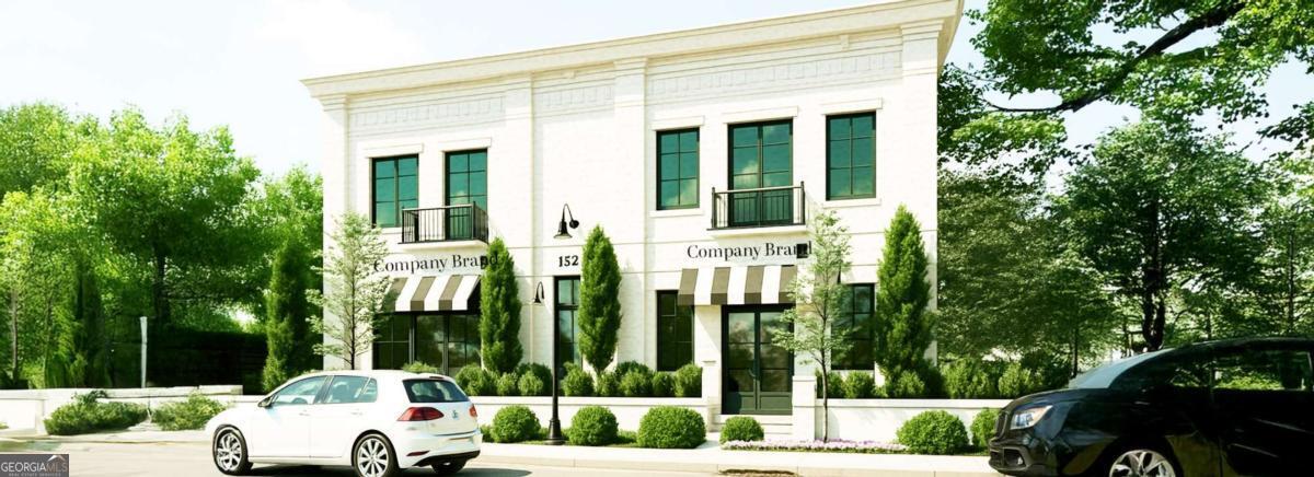 152 Marietta Street is a fully permitted, mixed-use project located in the heart of historic Downtown Alpharetta. This one-of-a-kind opportunity allows multiple options to customize as you desire. Outfitted with approved architectural plans, the project is designed to become a mixed-use commercial building with a 4,000 square - foot luxury condo on the second floor. Whether you're an investor, entrepreneur, or owner-occupant, the groundwork has been laid for a seamless build and a sophisticated result. The proposed layout features two 2,000 square-foot street-level commercial spaces-perfect for retail, office, or hospitality use. With excellent visibility and accessibility in one of Alpharetta's most dynamic corridors, this property presents a huge investor opportunity to establish a flagship presence in a high-demand market. Above, the private residence showcases a modern open-concept layout with a chef's kitchen, expansive living and dining areas, and an elegant primary suite-ideal for those seeking a refined live/work lifestyle. An exceptional feature of the home is the 1,600 square-foot rooftop deck, complete with a fireplace and outdoor kitchen, creating a luxurious outdoor retreat with stunning views. With proximity to Downtown Alpharetta's vibrant neighborhood-including boutique shops, acclaimed restaurants, green spaces, and year-round community events-as well as just minutes from Avalon and GA-400, 152 Marietta Street offers unparalleled access, versatility, and value in one of Metro Atlanta's most sought-after locations.