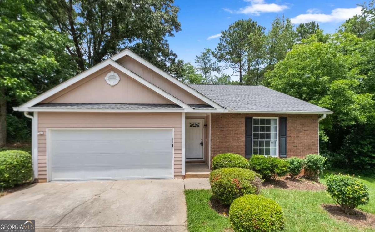 This updated home features an open layout with vaulted ceilings, vinyl wood floors, and a cozy fireplace. The kitchen includes white cabinets, stainless steel appliances, and a spacious island. Enjoy a private primary suite with tray ceiling, ensuite bath, and walk-in closet. Relax on the deck overlooking a wooded backyard. Just minutes to East Atlanta Village, Glen Emerald Park, and I-20 - downtown is only 15 minutes away! Schedule your tour today!