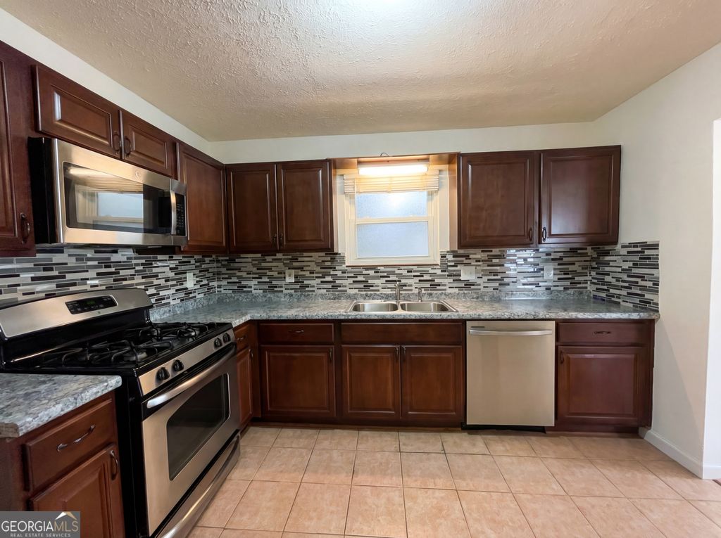 Photo of 5328 Ridge Forest Drive, Stone Mountain, GA 30083 (MLS # 10697128)