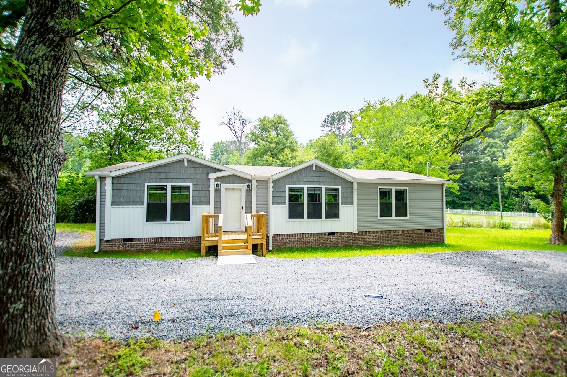 Welcome to your brand new farmhouse ranch home situated on a permanent foundation! Priced well below the market value the Washington has everything you need-and nothing you don't. With 3 bedrooms, 2 bathrooms, and a smart, open layout, this home is designed to give you space to grow without stretching your budget. From the moment you step inside, you'll notice how open and inviting the family living area feels-perfect for cozy nights in or having friends over. The brand new kitchen comes with new modern, energy-efficient stainless steel appliances, and plenty of marble counter top space, so whether you're meal prepping or making midnight snacks, it's got you covered. The spacious primary bedroom includes a walk in closet and private bathroom with double vanities, a soaking tub, and a oversized separate shower. The two additional bedrooms are spacious and well suited for a growing family, roommates and/or a home office. Everything is built with comfort, quality, and efficiency in mind-so you can feel confident you're making a smart investment. Home is on a permanent brick foundation and move-in ready. Schedule your tour today and ask about this limited time 4.99% interest rate opportunity or our no money loans!