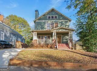 Discover this stunning Craftsman-style home featuring 3 bedrooms and 2.5 baths, along with a separate 2-bedroom, 1-bath apartment below, nestled in the historic Grant Park neighborhood. Located just one street away from the picturesque Grant Park and Zoo Atlanta, this property offers exceptional versatility. The basement apartment is perfect for accommodating parents who are moving in, or it can be utilized for Airbnb rentals, long-term rental income, or as housing for your college-age children, allowing you to save on room and board. This property boasts an array of attractive features, including off-street parking and spray foam insulation in the attic. Newly renovated kitchen. New quartz countertops throughout. New appliances. And a freshly painted interior. All three furnaces and three A/C units have been recently replaced, with service agreements (warranties) on three of the furnaces and one A/C unit. Enjoy beautiful hardwood floors throughout the main home, complemented by luxury vinyl plank flooring in the basement apartment. This is a must-see property with so much to offer-too much to list!