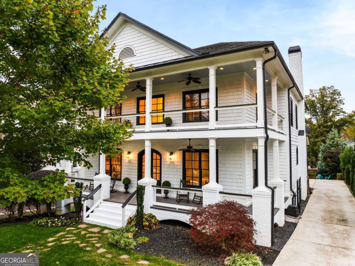 Discover a stunning luxury home in Historic Brookhaven, conveniently located near top rated medical facilities and hospitals, private schools, retail, restaurants and more. Wrap-around front porches welcome you inside with an abundance of natural light throughout all three levels. This thoughtfully designed residence offers an ideal flow for entertaining, with solid hardwood floors throughout both main and upper levels, a large and open kitchen with luxury appliances, Quartz and marble counters, bar prep nook with a beverage cooler, open-concept living area with a fireplace and coffered ceiling with French doors leading to a private covered patio. Boasting four bedrooms on the upper level, one on the main with an en-suite, and two on the finished terrace level with an en-suite for one of the bedrooms, this home provides exceptional space across three levels. The expansive primary suite features a fireplace, spacious separate sitting room, access to upper level front porch and generous bath with two walk-in closets. Enjoy 10' ceilings, a newly updated basement with a full kitchen and walk-ina pantry, living area with gas log fireplace, two bedrooms, 2 baths with interior and exterior access. On the main level is a spacious three-car garage with plenty of storagel. For perfect relaxation, enjoy the private covered back porch overlooking a fenced backyard and firepit. The home is Ideally located just minutes from Brookhaven's sought after restaurants, boutique shopping, Chastain Park, new water park, green spaces, top rated hospitals, medical facilities, interstates and nearby luxury retail therapy in Buckheads shopping districts. Experience the perfect blend of elegance and convenience in this exceptional home