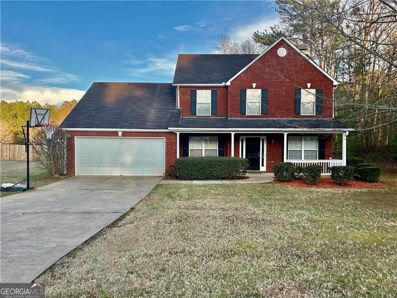 Welcome to this charming 3-bedroom, 2.5-bathroom traditional home, built in 2003. This two-story residence offers a perfect blend of classic design and open space. As you step inside, you'll be greeted by your traditional dining room and den, which is most often lost on newer builds. Follow the hall to the living room equipped with wood burning fireplace and then around to the cozy kitchen already installed with all appliances that you may need. Upstairs, the master suite boasts a walk-in closet and an en-suite bathroom with dual vanities, a soaking tub, and a separate shower. Two additional bedrooms share a full bathroom, providing plenty of space for family or guests. The home also includes a convenient laundry room on the upper level. Outside, you'll find a large, beautifully landscaped yard, ideal for outdoor entertaining. The attached two-car garage offers additional storage space. Located in a friendly neighborhood with easy access to schools, parks, and shopping, this home is perfect for anyone looking for comfort and convenience. Above all else, this home is clean and move in ready. Professional pics coming