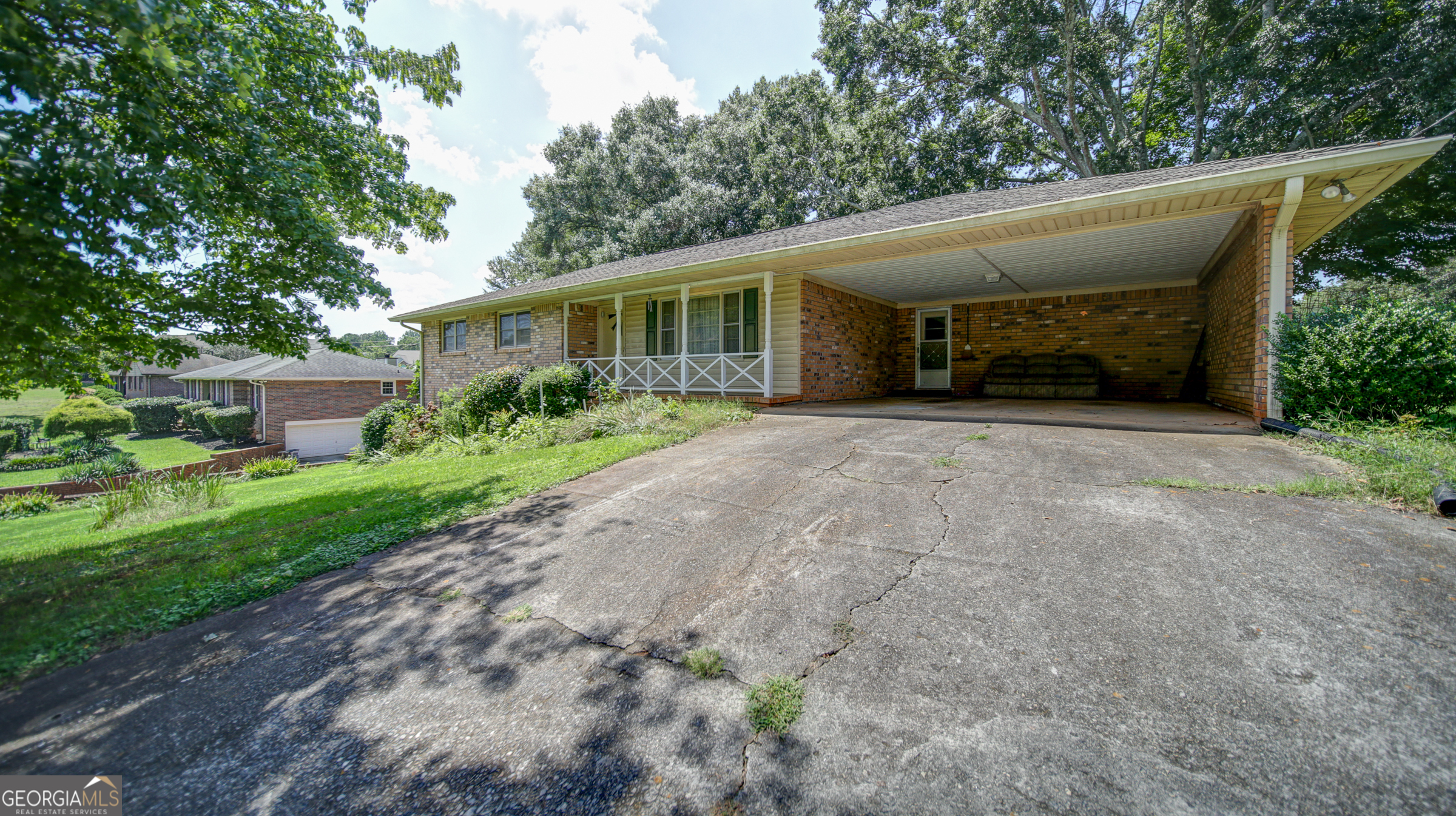 Quality-built ranch home located in the highly desirable Forsyth County school district. Offering 3 bedrooms, 1.5 bathrooms and unfinished basement, comfortable single-level living, this property provides both privacy and space to enjoy. Solid and a well-maintained structure give this home exceptional potential for customization - bring your vision and create the perfect space to fit your lifestyle. Inside, the home features a traditional ranch layout, ideal for easy living and accessibility. The large backyard offers a quiet retreat, perfect for morning coffee, afternoon barbecues, or gardening. Mature trees and established landscaping provide natural beauty and shade, while the generous yard offers opportunities for outdoor entertaining. Location is unbeatable - you'll enjoy the peace of a private setting while being just minutes from award-winning schools, shopping, dining, and quick access to GA 400 for an easy commute. Whether you are a first-time buyer seeking a great location, a downsizer looking for single-level convenience, or an investor searching for a property with strong potential, a little cosmetic updates make this one work!