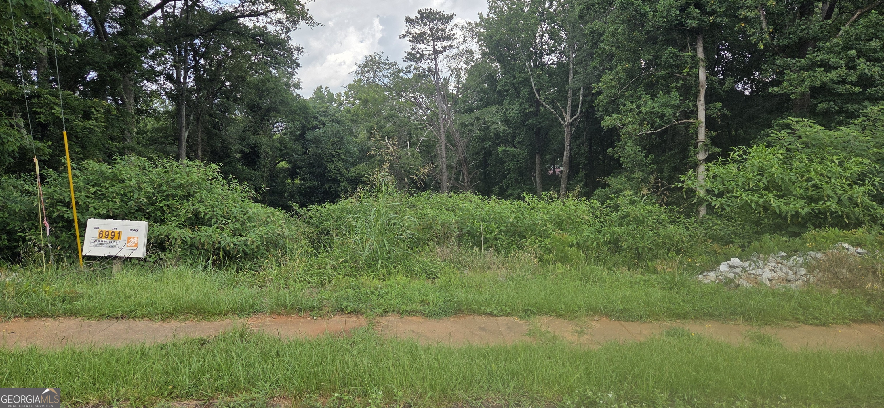 Don't miss this excellent opportunity to own a prime piece of land in Lithonia! This spacious lot offers endless possibilities for building your dream home or investment property. Nestled in an established neighborhood with convenient access to I-20, shopping, dining, and local parks, this property combines peaceful surroundings with great connectivity. Whether you're a builder, investor, or future homeowner, this lot provides a fantastic canvas for your vision. Utilities are available nearby. No HOA. Build your future here-schedule a visit today!