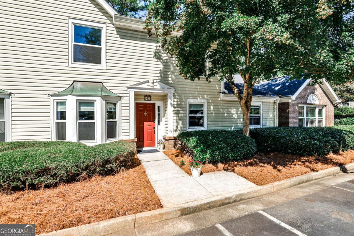 Life at The Condominium of Avondale Estates is about lifestyle and easy living! It offers the best of everything: a strong sense of community; low maintenance ownership; an outstanding HOA; a private pool where community events are held, like the July 4 BBQ; two private tennis courts for staying active with tennis or pickleball; meandering sidewalks to offer easy access to other Avondale assets like Avondale Lake, the Town Green, Tudor Village, parks, schools, retail shopping and dining. This light-filled, move-in ready townhome-style condo offers both space and location in the community's largest floor plan! Vinyl plank floors throughout the main level make for easy maintenance. The flow makes entertaining easy! There's also a bonus room, ideal for a home office, exercise, music, you name it! The oversized living room has a fireplace, is equipped with a wet bar, and direct access to the outdoor patio. Replacement windows throughout provide energy savings and allow the sun to fill each room with natural light! Upstairs is your retreat space--an oversized primary bedroom with two walk-in closets and an en-suite bath; two secondary bedrooms; an additional full bath; and a spacious laundry room. With 2,350 square feet, this townhome lives like a single-family home! All this in an active community setting make this condo and its location so desirable. Welcome home to good living! You're going to love this Avondale condo community and all it offers.