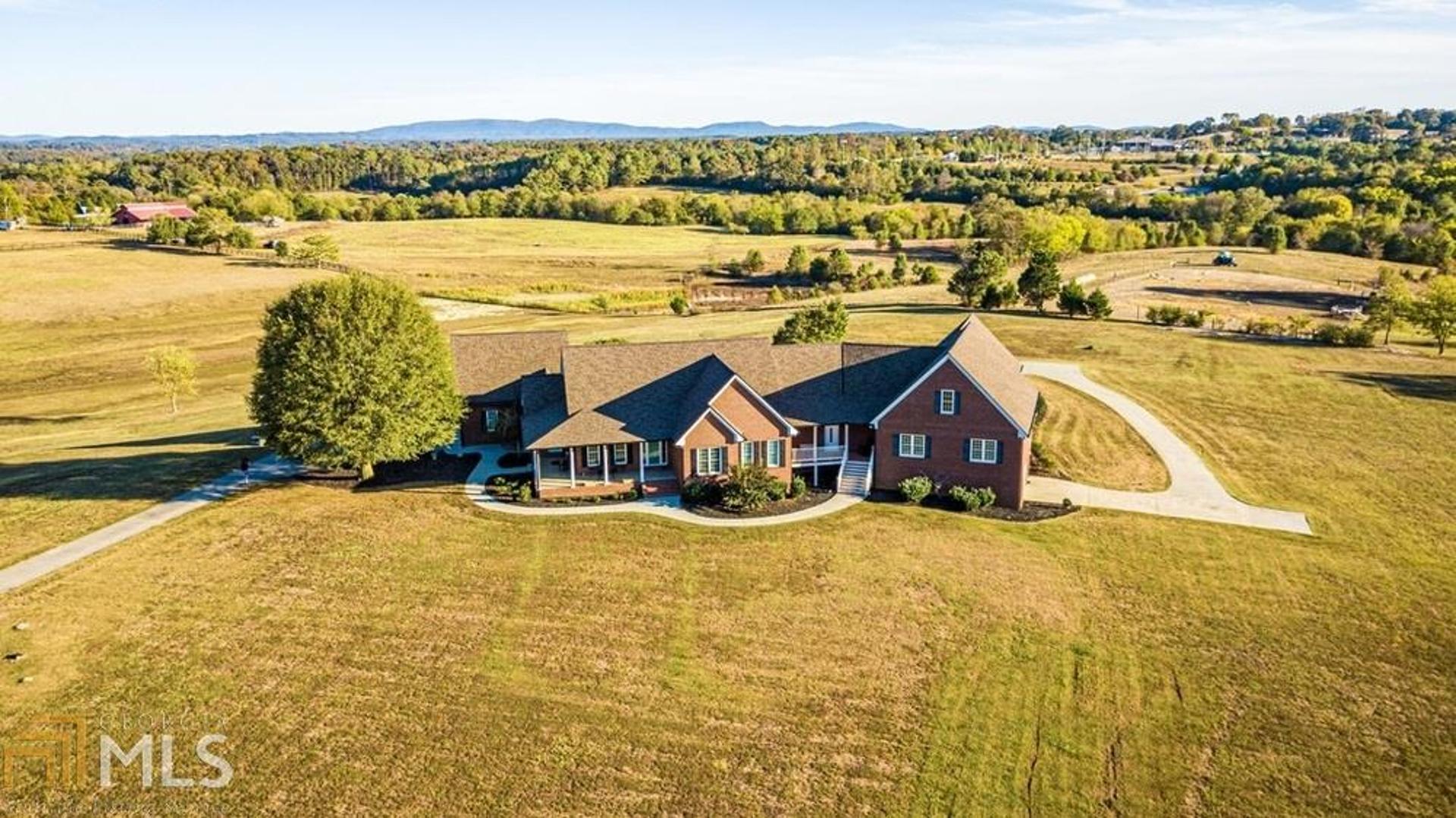 ROOM FOR 2 FAMILIES - BREATHTAKING CUSTOM HOME IN SERENE, SONORAVILLE COMMUNITY! Beautifully nestled on 7+ acres with bucolic views of adjoining pastures and distant mountain scenery, this one-level, custom brick estate features beautifully-flowing, uniquely designed, open-concept floor plan perfect for extended/multi family living. Priced below appraised value! Step inside to be welcomed into defined foyer space with open views of the footprint and gracefully gleaming hardwoods. Spend your evenings ... (See photos for full description)