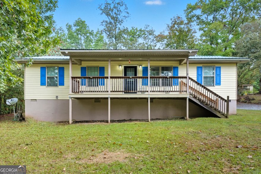 Charming 3 bedroom home on 1.78 acres!  Country living close to town, Enjoy the best of both worlds. This home features a rocking chair ready front porch overlooking the large front yard, along with a spacious back deck perfect for grilling. A private back yard begging for a fire pit! Many modern update waiting just inside. Only 5 miles from I75, shopping, and dining, this home is offers Privacy, space, and convenience! The Perfect Package!