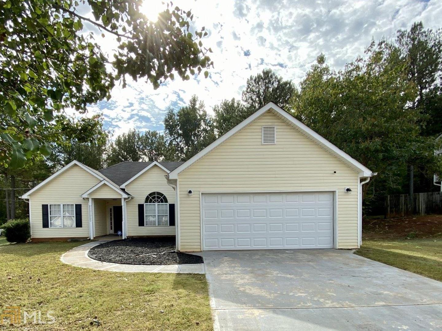 This 3-bedroom home offers a spacious open layout and features beautiful hardwood floors, fresh paint and updates throughout the home. Family room with vaulted ceiling and fireplace. Dining area features large window overlooking the front yard. Large master bedroom. Master bath with double vanity, tub, and newly renovated shower and flooring! Plus, a huge walk in closet! Kitchen features white cabinets, bar and breakfast area. Backyard includes a patio and leveled area great for play or entertaining.