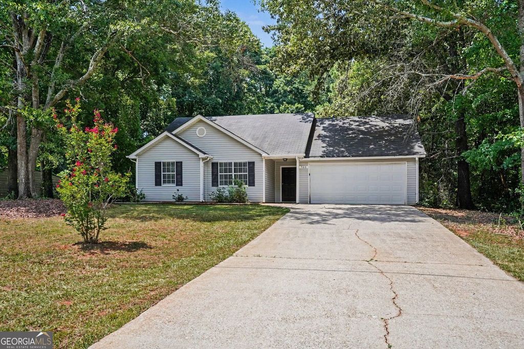 Photo of 560 E Country Woods Drive, Covington, GA 30016 (MLS # 10806423)