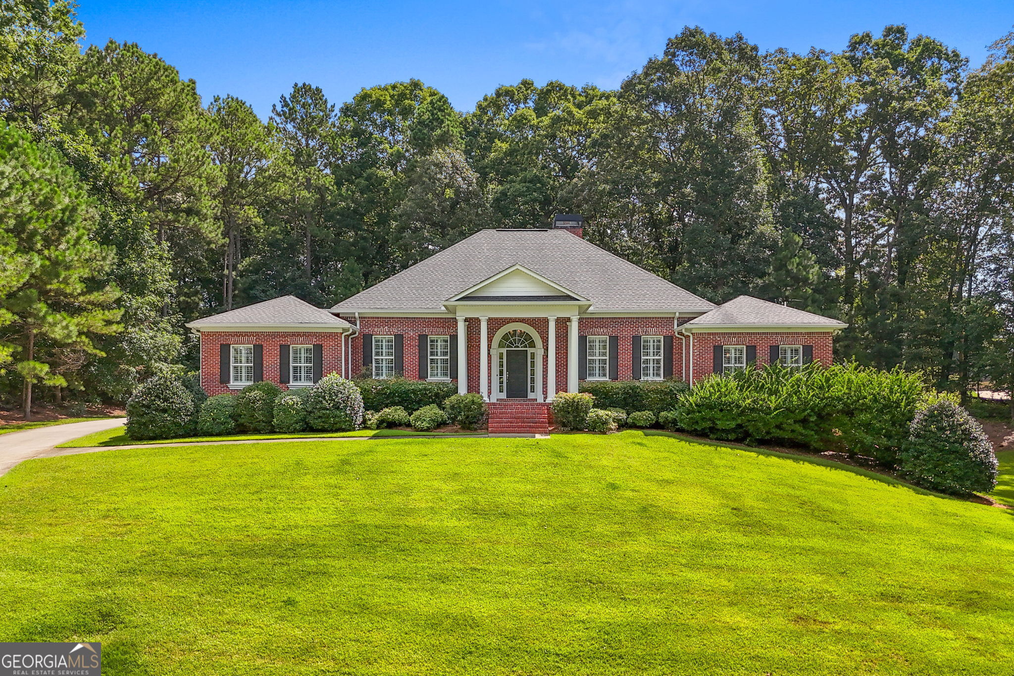 Welcome to this custom-built 4-bedroom, 3 1/2 bath all-brick ranch nestled on a 1.68-acre lot in the highly sought after golf community, Lake Dow Estates. This home features a thoughtfully designed split bedroom plan and offers a timeless blend of style, functionality, and comfort. The living room boasts high ceilings and oversized windows, providing an abundance of natural light and picturesque views of the stunning backyard. The kitchen is a chef's delight, equipped with stainless steel appliances, double ovens, gas cooktop, and a wet bar area for entertaining. The home also features a formal living room and a large formal dining room with elegant coffered ceilings, perfect for hosting guests. The master suite is spacious and includes a luxurious master bath with tile flooring, a soaker tub, and ample space for relaxation. The partially finished basement features a separate finished living space with fireplace, plus a recreation area. The unfinished portion is framed, stubbed for bath and offers a roll-up door, bringing endless possibilities. Enjoy the serene outdoors with the expansive lot, offering privacy and perfect for entertaining. This meticulously maintained, one owner home is a rare find in a prime location. Book your showing today!