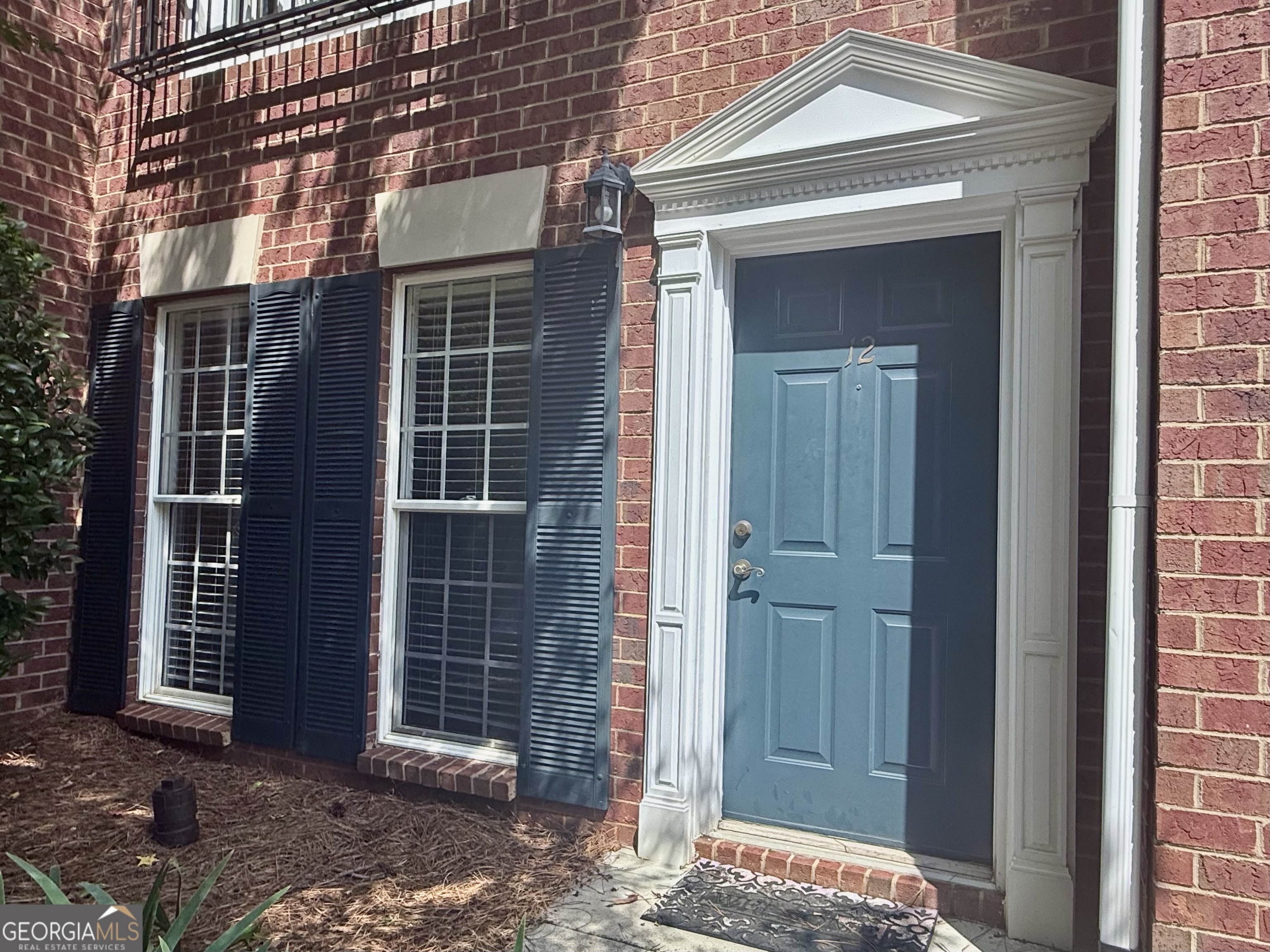 Prime Location - Gated Security - Low Maintenance Living Located in the sought-after Woodlake Community, this brick townhome has been updated and well maintained. This unit has assigned, covered parking located in the back just outside the private courtyard. As you enter the townhome, you'll notice the open layout with kitchen and living area. The main level also has a half bath, laundry closet, pantry, and storage closet. On the second floor there are two bedrooms with vaulted ceilings and each with a private bath. The master has French doors that open to a Juliet Balcony and an updated bathroom with walk-in tile shower. The kitchen has updated backsplash, sink, faucet, and granite countertop. The HVAC was replaced in 2022 including an Ecobee wi-fi thermostat and the unit is wired for a security system. The building has a brand new roof (2025) and exterior paint. There is an exterior storage closet located in the courtyard and unmarked, additional parking behind the assigned parking area in the back. Pool and pond are directly across the street from the townhome and walking areas are also included in the Woodlake amenities. This convenient location has easy access to 316 and Hwy 441. It's just minutes from Epps Bridge shopping or Downtown Athens and UGA. All appliances can stay including washer & dryer.