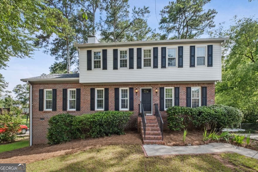 Top-Rated Pope High School! Private, Lush Backyard Retreat in the Heart of East Cobb! Welcome to this beautifully updated traditional two-story home, ideally located in the highly sought-after Pope High School district. This is your home!! Nestled on a level, half-acre lot, this home offers a private, fenced backyard oasis-sunny, spacious, and perfect for play, entertaining, or relaxing in nature. Step inside to a bright and flexible floorplan that suits today's lifestyle. The welcoming entry hall with a coat closet leads to a versatile dining room. Adjacent, a double living room provides incredible flow and space-ideal for hosting or unwinding. The formal living room features a cozy fireplace, while the vaulted family room is flooded with natural light from transom windows and skylights, accented by stylish sconces. From the family room, step out to a massive, brand-new deck that runs the full length of the home, offering a perfect vantage point over the lush, private backyard-truly a rare find in East Cobb. The spacious eat-in kitchen features maple shaker cabinets, stainless steel appliances, tiled floors, and a pantry, along with a convenient laundry closet and views of the backyard. Upstairs, the primary suite is a peaceful retreat. Two additional bedrooms share a hall bath with a tub/shower combo. The finished basement offers a large flex room ideal for a media room, home gym, playroom, or storage. Key Updates & Features: Top East Cobb Schools: Murdock ES, Dodgen MS, and Pope HS; Roof replaced 2025; New full-length back deck; New LVP flooring on main level Fresh interior paint; Abundant natural light throughout; EV Charger Don't miss your chance to call this East Cobb gem your home. Schedule your showing today and experience the perfect blend of location, layout, and lifestyle!