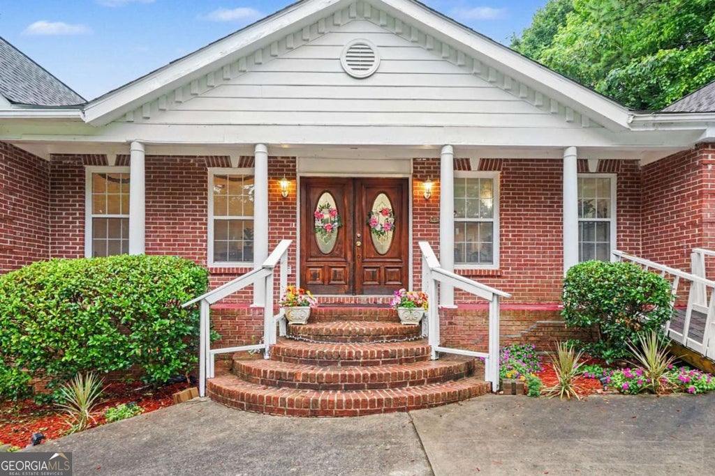 Photo of 5667 Miller Grove Road, Lithonia, GA 30058 (MLS # 10811183)