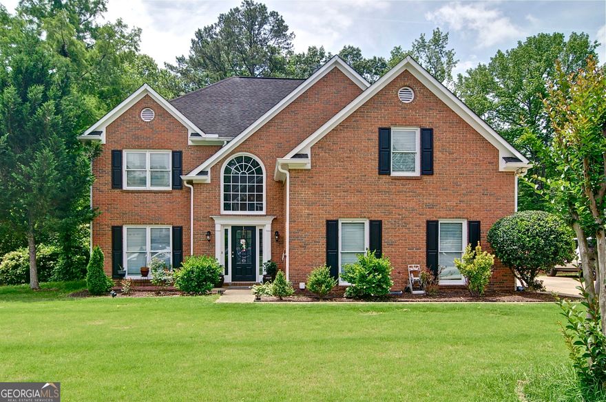 Quiet street, awesome neighborhood in Marietta.Great house that sits off the road and boast granduer and privacy.Completley fenced and private,very well maintained.Many..too many upgrades to list but newer HVAC, windows and roof are some.Formal and informal dining areas,granite tops and openness abound.Tall entry foyer, and the list continues.Very large .50 acre lot(one of the larger ones on the street)Back property lines extend past the fence, Drive up shed, flat green and  large area. Covered decks and sunroom and just a great home for a great family... Did I mention hardwoods throughout??  Dont think it will last so come see it and come make it yours!!
