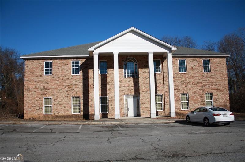 PRIME LOCATION...Seize the opportunity to transform this 9,000+sq. ft. commercial building to fit your vision! Whether you are looking to develop a daycare center, business complex, office space, or another creative venture, zoned general commercial, the options are endless. Second floor is partially renovated with drywall, electrical, and plumbing in place, awaiting your final touches. First floor is a blank canvas, with electrical, plumbing, and ductwork, ready for buildout to meet your needs. Located off of Fairburn Rd., walking distance to downtown Douglasville, and minutes from the highway. This spacious gem awaits your creative conversion!