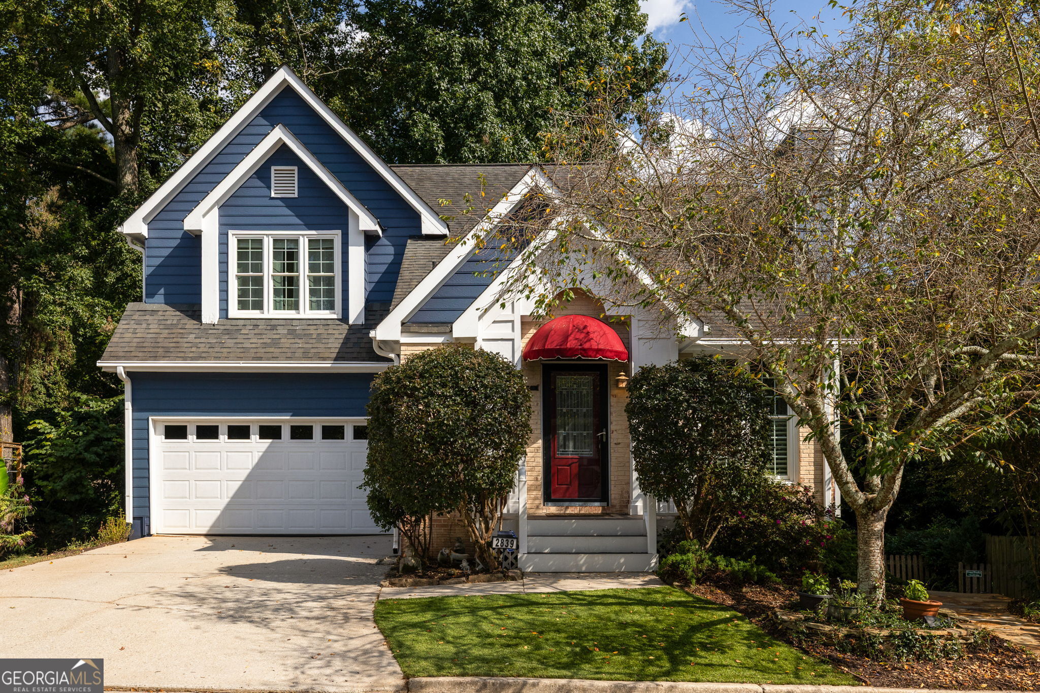 Tucked away on a rare Decatur cul-de-sac, this 3 bedroom, 3.5 bath home feels like a retreat while still being minutes from everything you need. Vaulted ceilings and wide windows open the home to the trees beyond, letting in natural light and a sense of calm that makes every day feel a little brighter. Inside, cozy details invite you to settle in, from the stacked stone gas fireplace to plantation shutters to a sunny loft just begging to be your reading retreat, home office, or extra bedroom. Fresh paint, updated finishes, and well-maintained systems mean you can move right in without worry. Downstairs, you'll find a finished industrial-style in-law suite with its own full kitchen, laundry, living room, dining area, and sleeping area accessed from interior or exterior. A flagstone path leads to its private patio, making it an inviting space for guests, extended family, or even a quiet home office tucked away from the rest of the home. Out back, the covered deck makes gathering easy in every season, while the fenced yard and low-maintenance turf keep weekends free for enjoying, not mowing. Two cheerful garden beds add color without fuss. Step beyond your door to nearby walking trails, the PATH, and Legacy Park, or head just around the corner to the brand-new Publix. All of this comes with the advantage of being right outside the City of Decatur, so you can enjoy the location with lower taxes. This isn't just a house, it's a soft place to land, a Decatur gem that balances comfort, flexibility, and community.