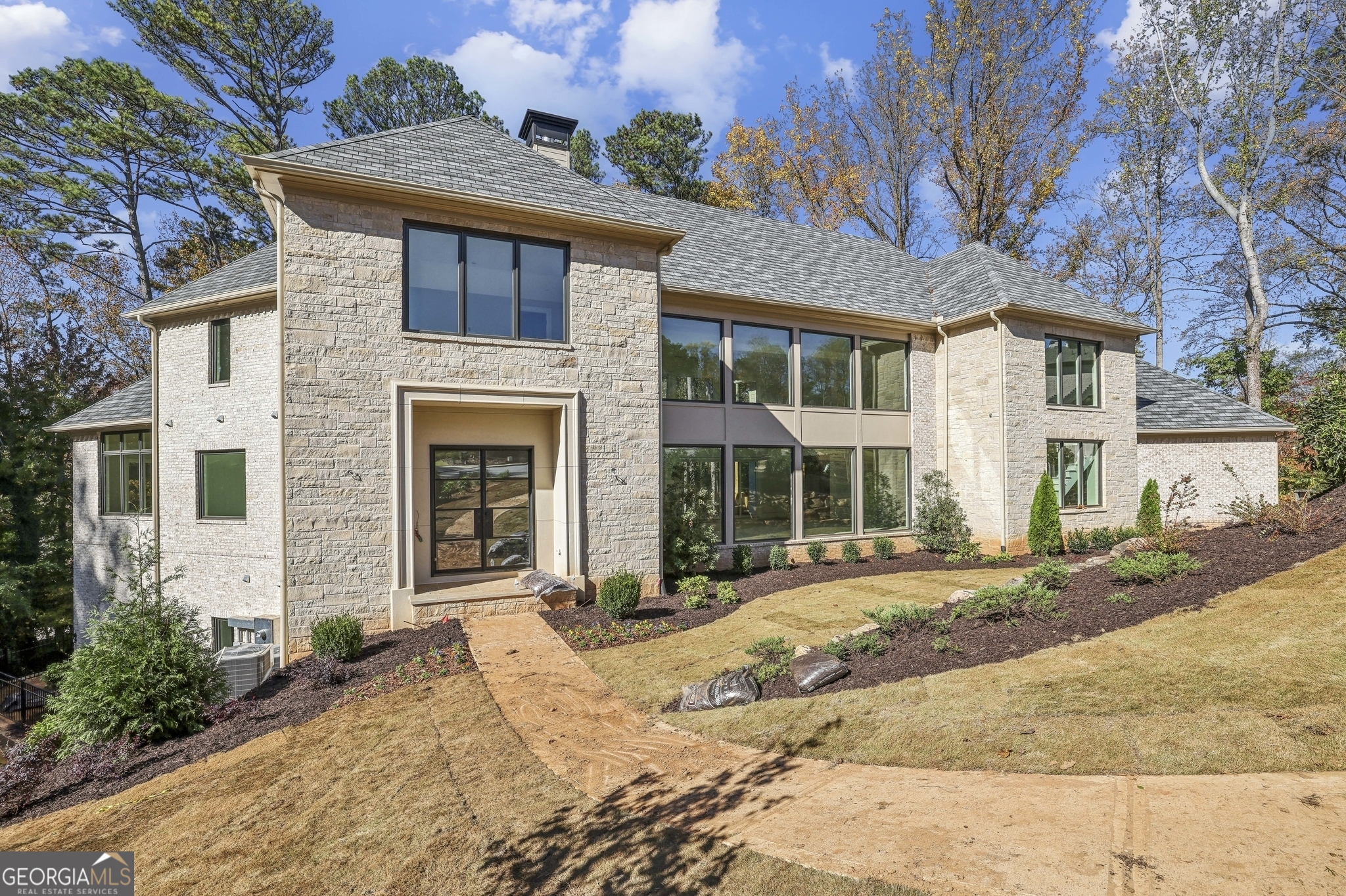 The last home is on a private cul de sac in North Buckhead. The plan offers casual elegance and a floor plan conducive to today's modern lifestyle. The primary suite is on the main level with a luxurious bathroom, a chef's kitchen with all the bells and whistles, and a sun-drenched great room with a fireplace and wall of windows overlooking the private backyard with a pool and home office. Upstairs boast 3 spacious bedrooms with ensuite baths. Covered Porch with fireplace and large Veranda. Finished terrace level with Bar, wine Cellar, Bedroom & Bath, and Pool Bath. 3 Car Garage. This prime location is close to shopping, restaurants, and parks.