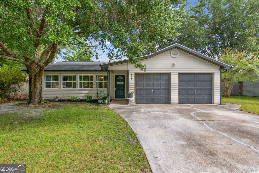 Step into this beautifully updated 4-bedroom, 2-bathroom residence that feels brand new! As you enter, be greeted by a charming foyer that doubles as a sun porch or dining area-imagine the gatherings you can host in this versatile space! The heart of the home is the kitchen, featuring wrap-around windows that bathe the room in natural light, complemented by custom shelving and ample storage designed to meet all your culinary needs. The cozy great room invites you to unwind, adorned with shelving that adds a touch of character. Retreat to the owners' suite, a sanctuary of comfort and style. This expansive room showcases stunning shiplap accents and a custom barn door leading to a luxurious bathroom-a perfect blend of modern design and rustic charm. Step outside to your spacious backyard, where two distinct patio areas await, ideal for relaxation or entertaining. This home is equipped with a comprehensive water filtration and softening system, ensuring quality throughout. Enjoy peace of mind with ADT security wiring, cameras, and locks.  Every inch of this home has been thoughtfully updated:   - LVP flooring in all bedrooms, the kitchen, and the master bath   - Fresh paint in every room  - A stylish beverage fridge for your refreshments  - Renovated laundry room with custom shelving  - Unique bedroom features, including a shiplap accent wall and a navy-blue accent wall in the back bedroom  Don't miss the opportunity to own this exceptional home.
