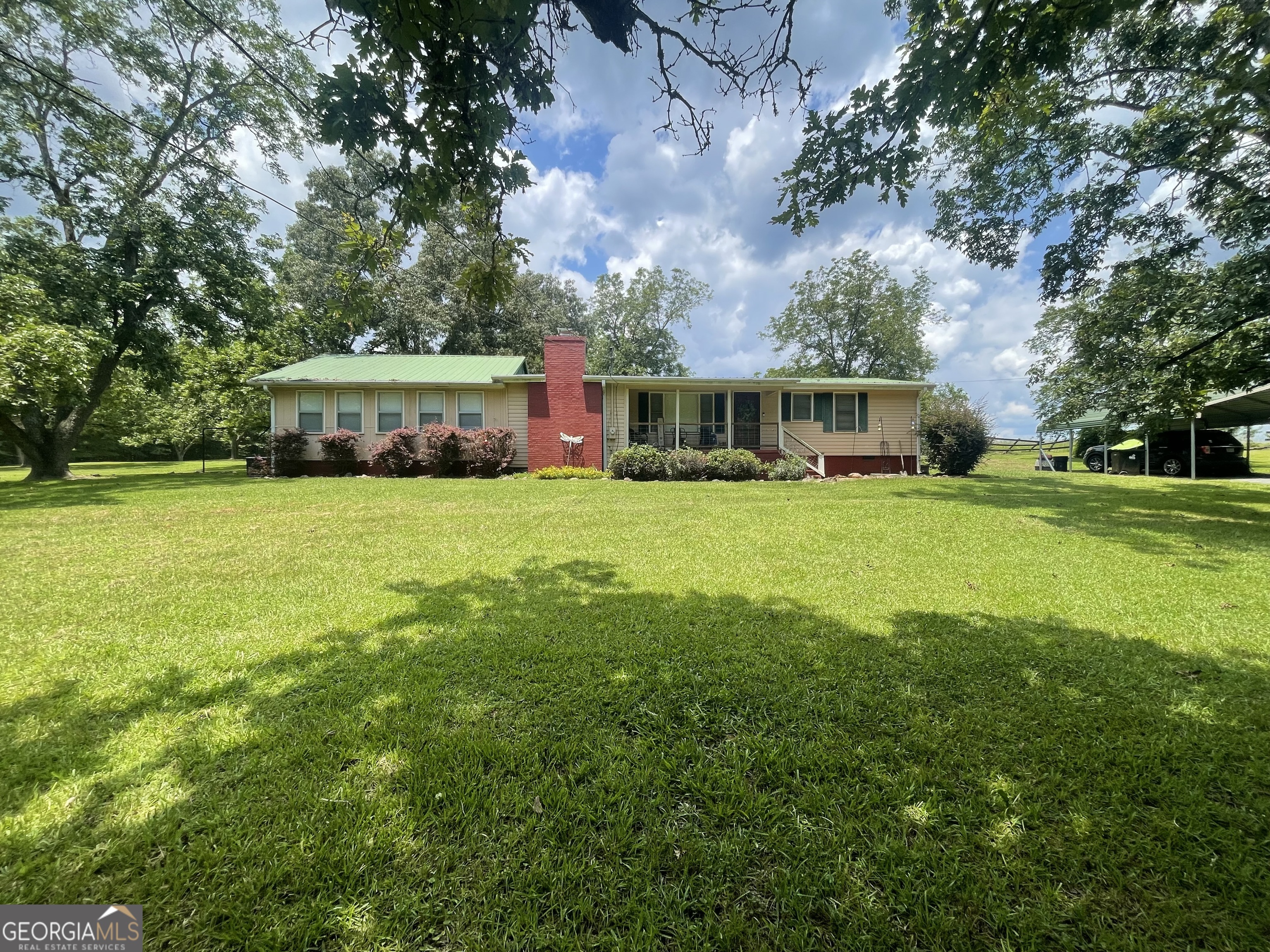 Step back in time and enjoy the peaceful charm of this cozy 2-bedroom, 1-bath home nestled just outside the city limits of Thomaston. Situated on over an acre and sold as two separate parcels, this unique property offers room to expand or build while preserving your privacy and connection to nature.Inside, you'll find original hardwood floors, two cozy wood-burning fireplaces, and over 600 square feet of flex space-perfect for a studio, workshop, home office, or future expansion. The layout is simple and functional, with timeless character and solid bones. Whether you're sipping coffee by the fire or watching deer wander through the yard, this home offers the quiet retreat you've been dreaming of-all just minutes from town. Enjoy the best of both worlds-peaceful country living with city convenience just down the road.