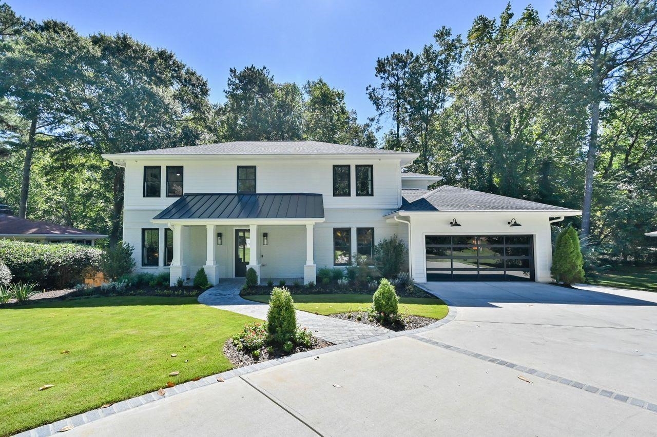 Luxury in Buckhead awaits! This Modern Farmhouse with exquisite finishes features 3 stories of elegance, 5 bedrooms, 5.2 baths, an open concept floor plan, Chef's kitchen with quartz countertops, custom shaker-style cabinetry, and high end appliances! Entertaining is easy as this home boasts of natural light, 10ft plus ceilings on the main, a media room, an outdoor deck, and a private expansive backyard, perfect for a pool. The owner's suite hosts a spa-like ambiance with a soaking tub and double vanity, prime for relaxation. The fully finished basement includes a kitchenette, 2nd laundry, and Media Room! Only minutes away from shopping and fine dining experiences. Make this home yours today!