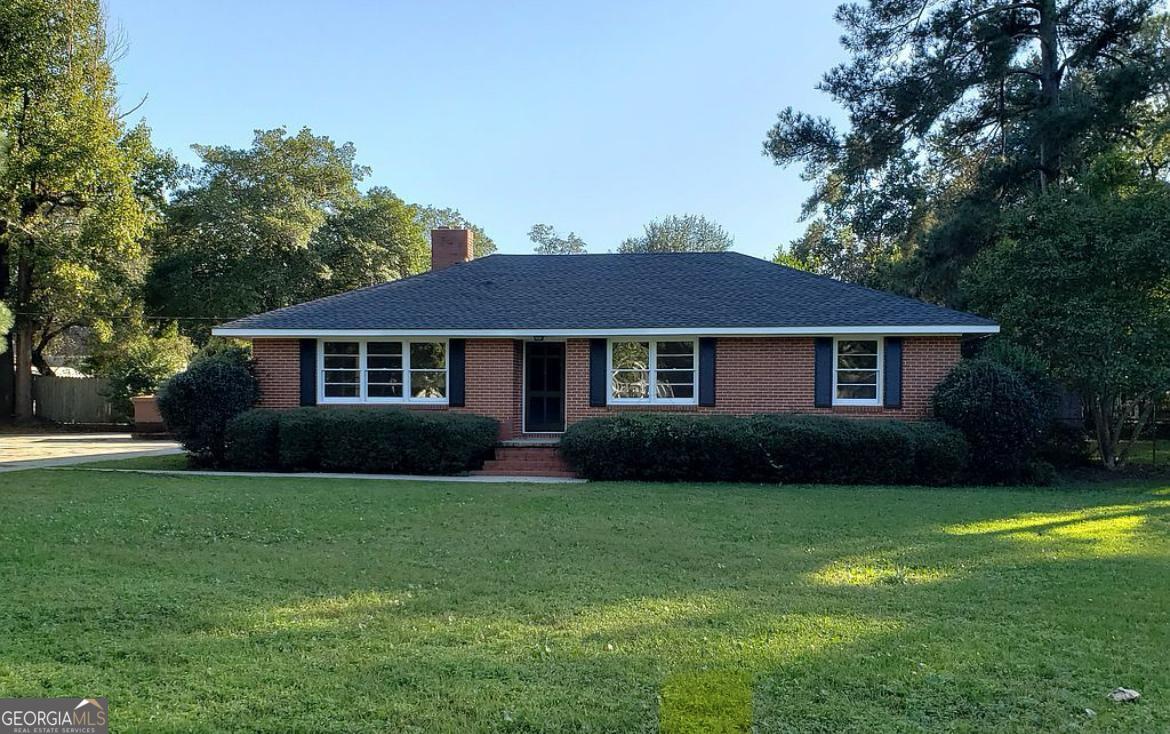 Step into timeless style and comfort with this brick home built in 1956. Situated on a large corner lot overlooking a beautiful park, this home offers the perfect blend of classic character and modern living. Inside, you'll find hardwood floors and an open kitchen that flows seamlessly into spacious family room-perfect for entertaining and relaxing. The family room opens to a covered patio, ideal for enjoying morning coffee or evening gatherings year-round. This home combines mid-century charm with a functional layout. Don't miss your chance to make it yours!