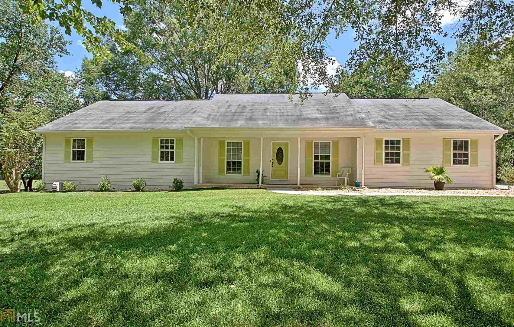 Welcome home to this beautiful, move in ready, ranch home on one full acre with mature landscaping. Notice the freshly painted exterior as you walk up to the large front porch perfect for relaxing and drinking your morning cup of coffee. The front door opens to a large family room with fireplace and exterior door leading to nice-sized screened in porch off the back of the house. Separate dining room leads to the kitchen with stainless steel appliances, new dishwasher, new faucet, refrigerator (stays with the house) and lots of cabinet space! New quartz countertops have been purchased and will be installed very soon. Breakfast area with bay window and laundry room are off the kitchen as well. On the other side of the house you will find 3 nice sized bedrooms and 2 full bathrooms. Master bath has dual sinks, jacuzzi tub and separate shower. Hall bath has brand new vanity. Driveway has lots of parking available and garage is side entry, opening directly into the kitchen. If you are looking for some yard space, look no further. This yard is absolutely beautiful and perfectly flat for a nice pool too. Close to downtown Fayetteville, Pinewood studios, shopping and restaurants. New Hardie Plank siding has been added in some places and entire home has new exterior paint. New 50 gallon hot water heater has also recently been installed. Come take a look and make this house your home today!