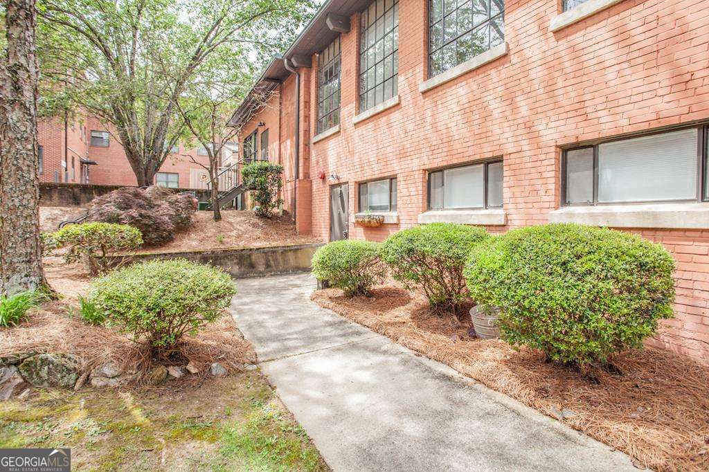 This unit is located right off the historic square in Carrollton. Walking distance to the AMP, restaurants, shopping, and more! So much character and charm with a full wall of windows on the upper floor showcasing the open concept living area and kitchen. The bedroom, bath and laundry are located on the main level. Original hardwoods throughout. Refrigerator included. HOA is $185 a month.