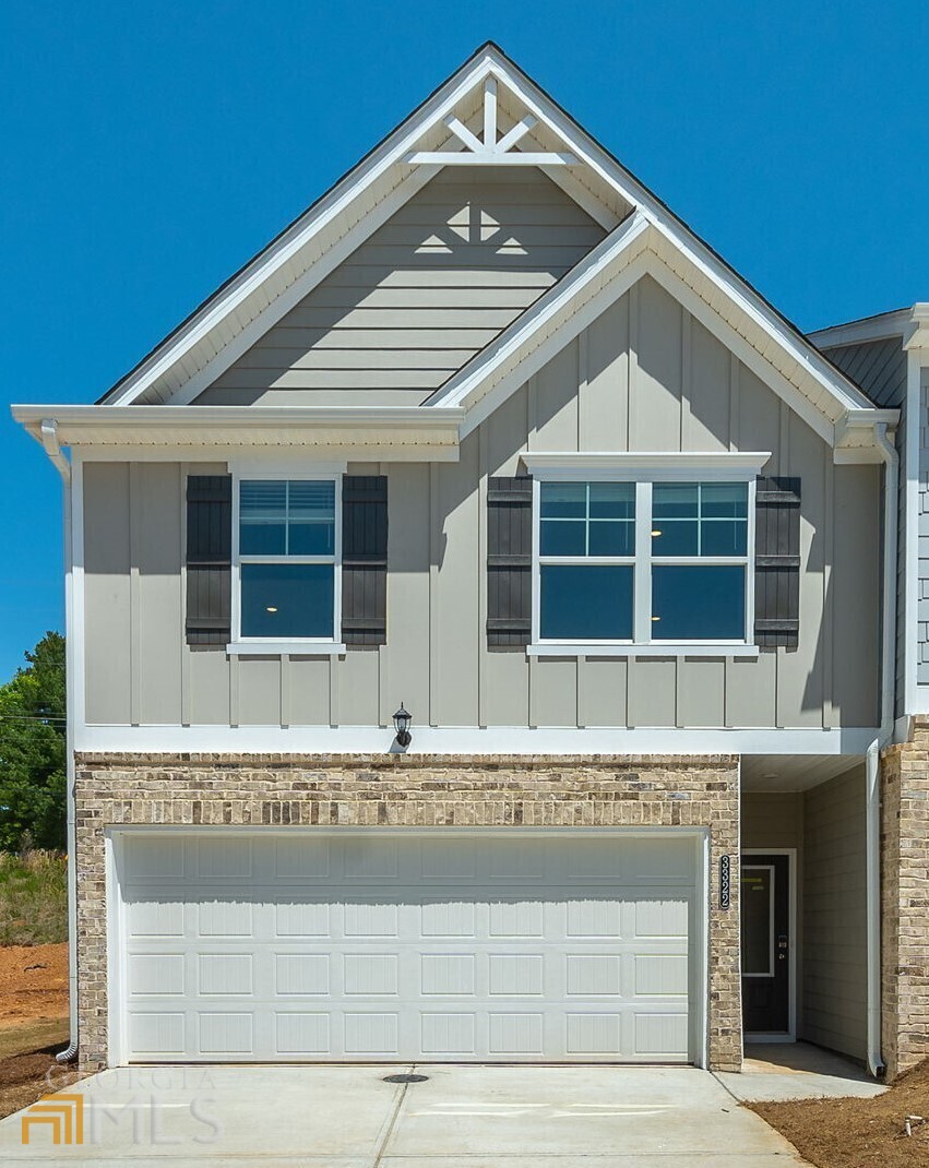 Lexington Plan - YOUR SEARCH IS OVER , Brand New Townhome. The Enclave at Austell is a beautiful up and coming Townhome community offering low maintenance lifestyle just minutes from the East West Connector. Highly desired END Unit is design with a modern open concept & great entertaining space. Family room w/cozy fireplace opens to Kitchen features granite countertops, large island, 36 white cabinets and Laminate flooring. Second floor offers stunning Master suite w/spacious bath & duel vanities, 2 spacious guest bedrooms & hall bath w/granite counters**STOCK PHOTOS**
