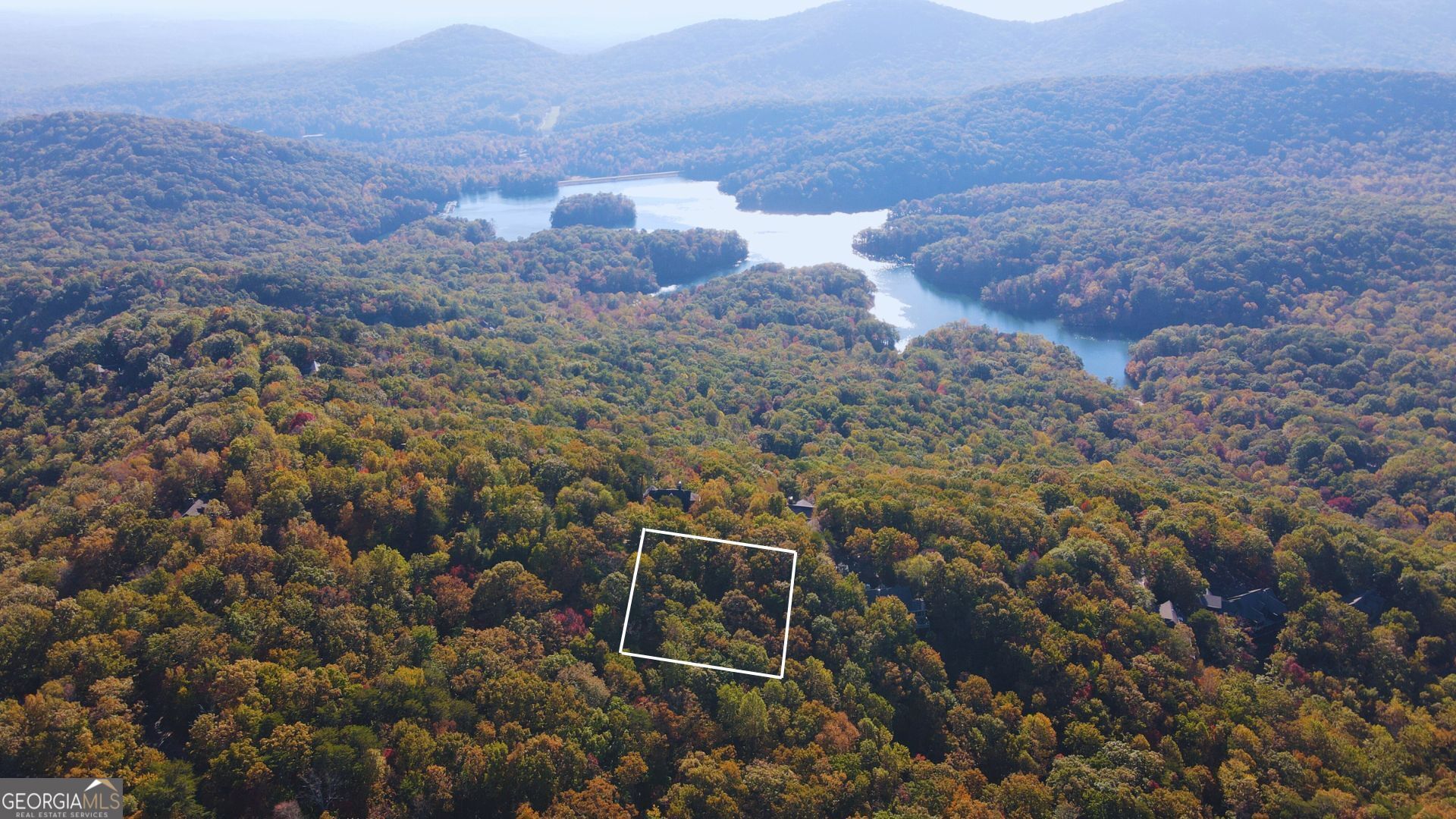 Escape to the serenity of Big Canoe! This prime residential lot offers the perfect blend of privacy and potential--perched for stunning mountain views. Build your dream retreat in this coveted gated community with top-tier amenities. It is 5 minutes from the North Gate entrance. Big Canoe is an 8,000 acre gated community in the Blue Ridge Mountains of North Georgia. Don't miss this rare opportunity! Level 3 soil test and survey already completed. Lot is situated opposite the home at 77 & 49 Wood Fern Knoll. It is 5 minutes from the North Gate entrance.