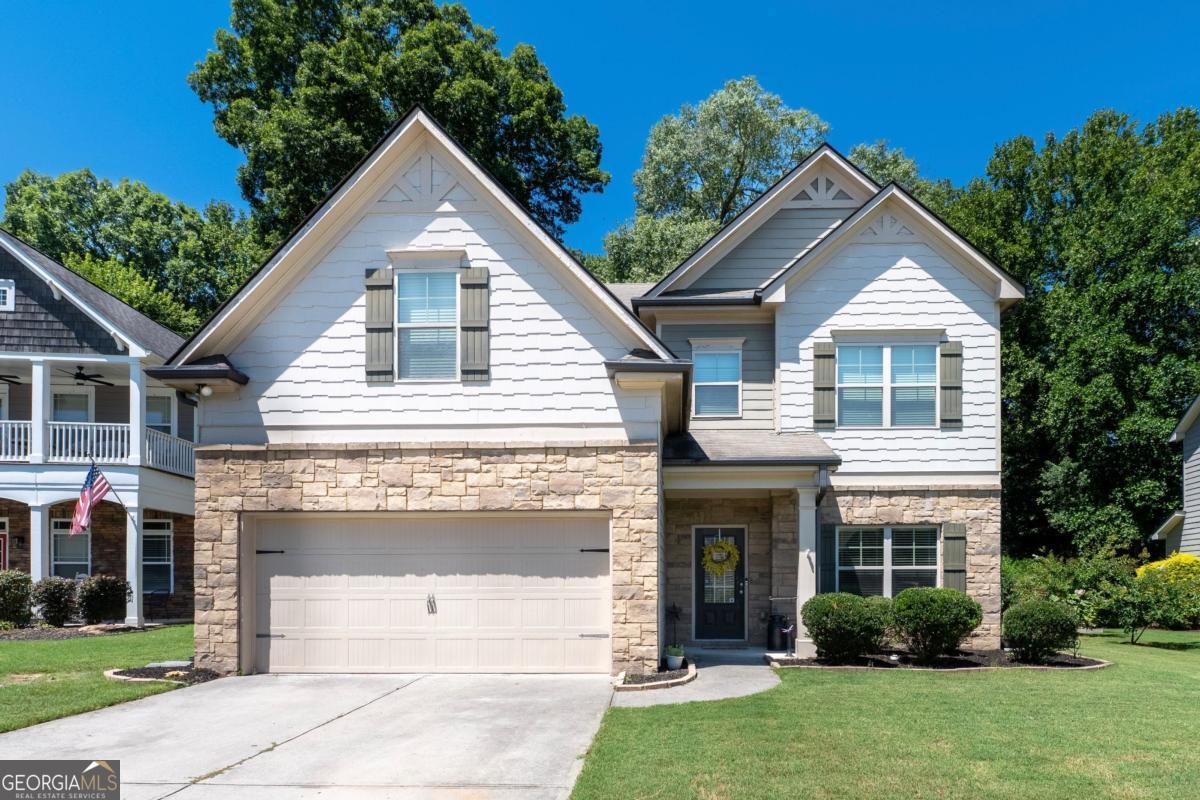 The sellers are highly motivated, and this home is priced to sell-an incredible opportunity to live in one of Braselton's most sought-after communities. Life feels a little sweeter in Riverstone Park, and this 4BD/3BA Craftsman sits right in the heart of it all. Just a golf cart ride away from playgrounds, pickleball matches, pool days, and neighborhood events where everyone knows your name, this is a home made for connection and comfort. Step inside to an inviting layout with a full bedroom and bathroom on the main floor-perfect for guests or a private home office. The kitchen, with its oversized island, sets the stage for everyday meals and weekend gatherings. The living room fireplace adds cozy charm, while the dining room's wainscoting brings timeless character. Upstairs, you'll find a spacious primary suite for unwinding, a shared Jack-and-Jill bath between two bedrooms, and a versatile loft space for movie nights or homework hangouts. End the day outdoors under the covered patio, fireplace crackling, favorite show on the mounted TV, and neighbors waving as they drive by in their golf carts. This home offers comfort, community, and convenience all in one perfect package-don't miss your chance to make it yours before it's gone.