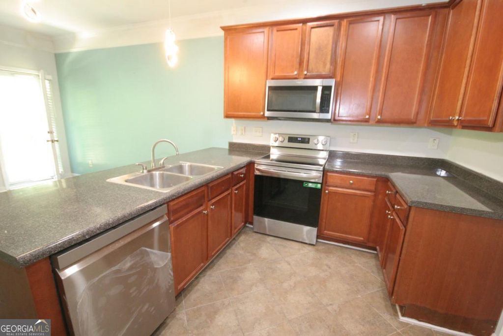 Photo of 4991 Lower Elm Street, Atlanta, GA 30349 (MLS # 10740975)