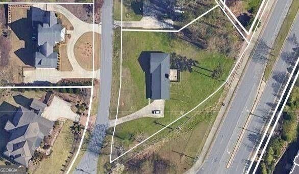BUILDER ALERT! Large residential lot with panoramic city views in upscale residential area with beautiful million dollar plus homes. The value of the property is in the land, but the home is in great shape with many updates sitting on a lot that is level across the front, gently sloping to the back. With the classic ranch 3 bed, 2 bath main level, this home also features a basement with a bedroom and bath as well as a garage. The lot is currently zoned R30 but is surrounded by much more dense housing so partitioning to 2 lots at R20 should be easily doable. A package with an older survey, sewer & water map, recent area activity and more is available on request. Please schedule an appointment before accessing/walking the property to respect the privacy of the sellers - however, it is fairly easy to get a general idea of the lot's topo layout from a drive-by as it is viewable on 3 sides.