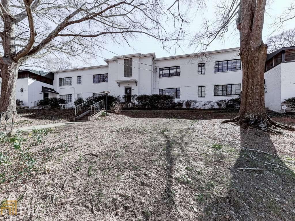 Fabulous mid-century modern condo! Original hardwood floors throughout. New paint. Lots of natural light! Custom blinds to accommodate the large windows throughout the unit. Large, open living space. Bright kitchen with ample cabinet storage. Separate dining room area with view & entrance to private porch. 2B/2Ba. Master bath en suite & has been updated. Parking spot included with unit. Centrally located in the Emory Druid Hills area. Close to shopping & nightlife of Virginia Highlands, Ponce, & Decatur. Don't miss the chance to make it your home!