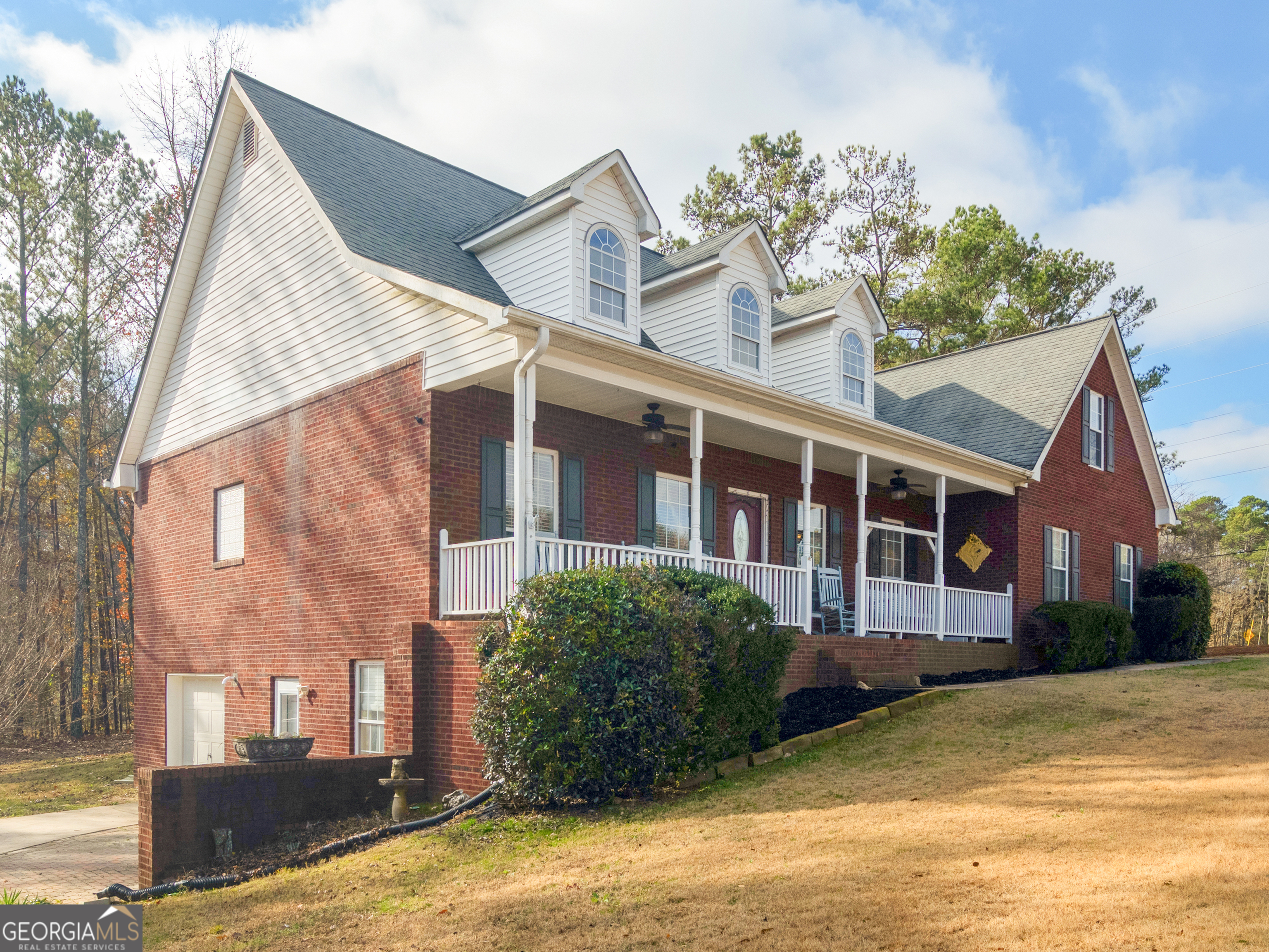 **Ask about how you can receive a permanent INTEREST RATE BUYDOWN with a full price offer plus up to a $1,500 lender credit when using the seller's preferred lender! Exclusions may apply. Interest Rate buydown is valid only with a full price offer.*** Spacious 4-Sided Brick Home on 1.38 Acres in Joyner Estates | Ola School District Welcome to this two-story 4-sided brick home on a partially finished basement situated on a private, partially wooded 1.38-acre corner lot in the sought-after Joyner Estates community. With timeless curb appeal, this home offers a welcoming covered front porch and a spacious open floor plan designed for modern living. Inside, you'll find soaring vaulted ceilings in the main living area, rich hardwood floors, and a separate formal dining room perfect for entertaining. The kitchen features Silestone countertops, stainless steel appliances, tile flooring, a breakfast bar, and a sunny breakfast nook with views of the backyard. The primary suite is located on the main level and includes trey ceilings, a walk-in closet, and an en-suite bathroom with a garden tub and separate shower. A central vacuum system adds convenience throughout the home. Upstairs, you'll find three spacious bedrooms, a full bathroom, and a loft-style office that overlooks the main living space-ideal for remote work or reading. The partially finished basement is built for versatility, offering a game room, theater room, and a full bathroom-perfect for guests or entertaining. The unfinished portion includes a full private driveway with a boat door, woodshop area, and built-in shelving for exceptional storage. With its private entrance, this space offers incredible potential for an in-law suite, teen retreat, or POTENTIAL RENTAL INCOME opportunity. Additional features include: Fresh interior paint, Full second driveway with private basement access, Tons of storage and workspace, Established neighborhood with large lots! Convenient to historic McDonough Square, shopping, dining, Georgia National Golf Club, and more! Located in the desirable Ola School District! Ask about how you can receive a permanent INTEREST RATE BUYDOWN plus up to a $1,500 lender credit when using the seller's preferred lender! Exclusions may apply. Offer valid only with a full price offer.