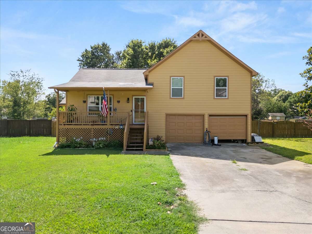 Just 10 minutes from Downtown Woodstock, this 3-bedroom, 2-bath split-level home is located in the Sugar Mill subdivision of Cartersville. Situated on a level 0.55-acre lot with no HOA, it offers a great opportunity for first-time buyers or anyone looking for a move-in ready home with updates already completed and room to personalize. Recent exterior improvements include new siding, new windows with screens throughout, storm doors with built-in screens on both the front and back, an extended back deck perfect for entertaining, and a Ring Doorbell that stays. A covered front porch adds curb appeal and charm, while the two-car garage features automatic openers and laundry hookups. Inside, the home features new wood flooring throughout, a bright living area with a gas fireplace, and an updated kitchen offering a new butcher block countertop, new backsplash, new sink, new dishwasher, new range, and a stainless steel refrigerator (all included). A new garbage disposal has also been installed. The hall bathroom includes new tile flooring, and the primary bath has an updated vanity top. Additional interior updates include new ceiling fans, new faux wood blinds, and a new thermostat. With major systems like the HVAC and water heater replaced in 2020, plus many cosmetic upgrades already complete, this home combines a convenient location, thoughtful updates, and solid value.